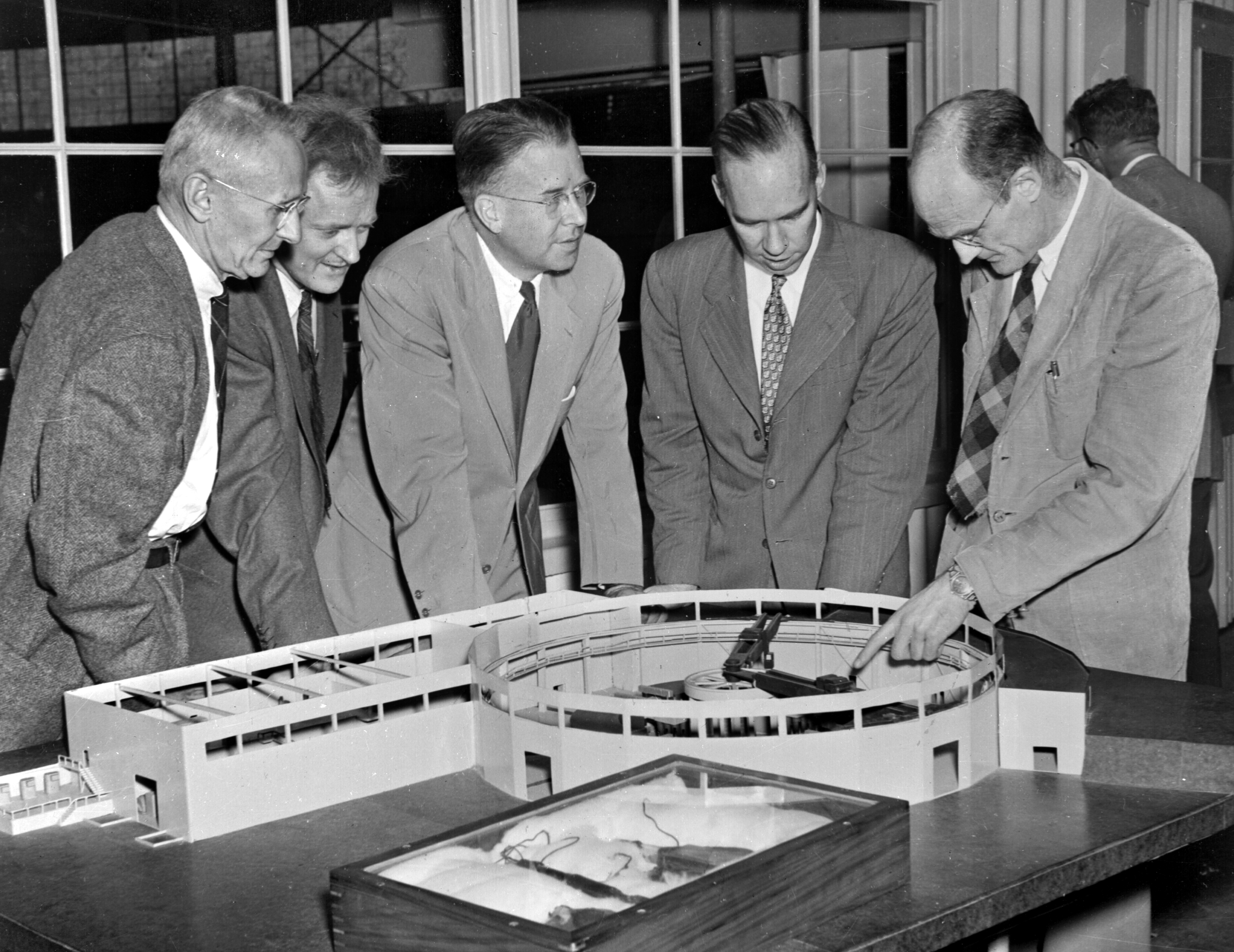 Left to Right: Professor Ernest Orlando Lawrence, William Brobeck, Dr. Harold Fidler And Dr. Donald Cooksey in the Bevatron core gap in Building 51. Photo taken November 22, 1950. Misc.-656.