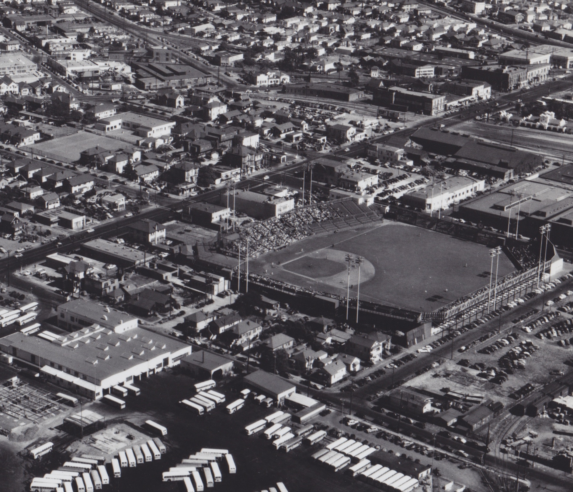 Aerial photograph of Oaks Park. View facing approximately ESE. The street between the ballpark and the bus yard is 45th (parallel to the 1st base line), and the street in the background in San Pablo Avenue (parallel to the 3rd base line). According to Transit Times (Feb 1975), this photograph was taken in August 1947.
