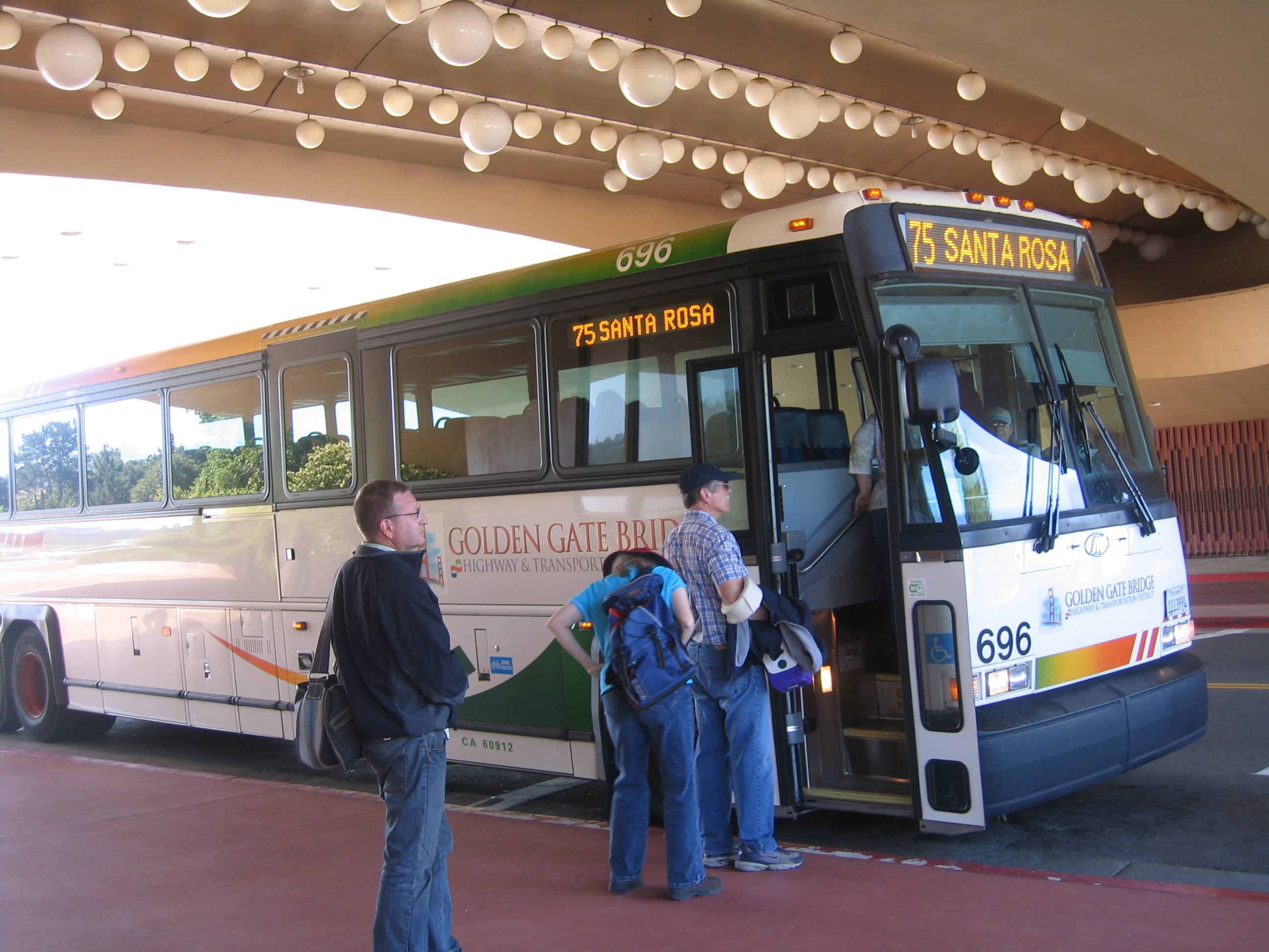 A new Golden Gate Transit MCI 45-footer commuter bus (number 696) taken at the Marin County Civic Center in San Rafael, CA. This bus also has Wi-Fi Internet on board.