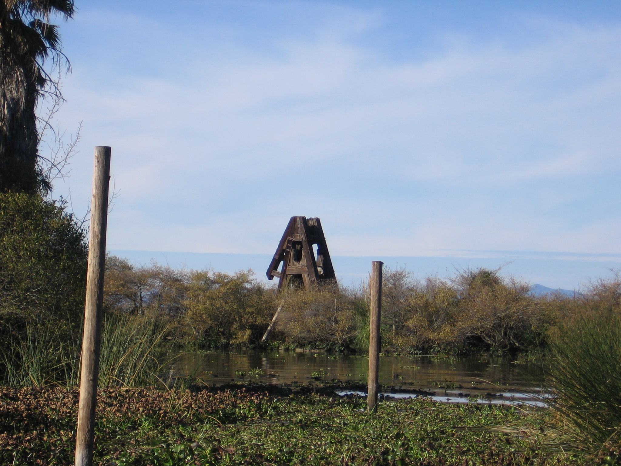 The remains of the Solano (ferry) in the San Joaquin River in Antioch, California, USA.  The ferry was sunk and turned into an island in the river shortly after the opening of the Benicia-Martinez rail bridge in 1930.  The prominent steel structure was an A-frame to support the "Walking Beam" apparatus at the top of the fidley of the ferry that was originally a sidewheeler.