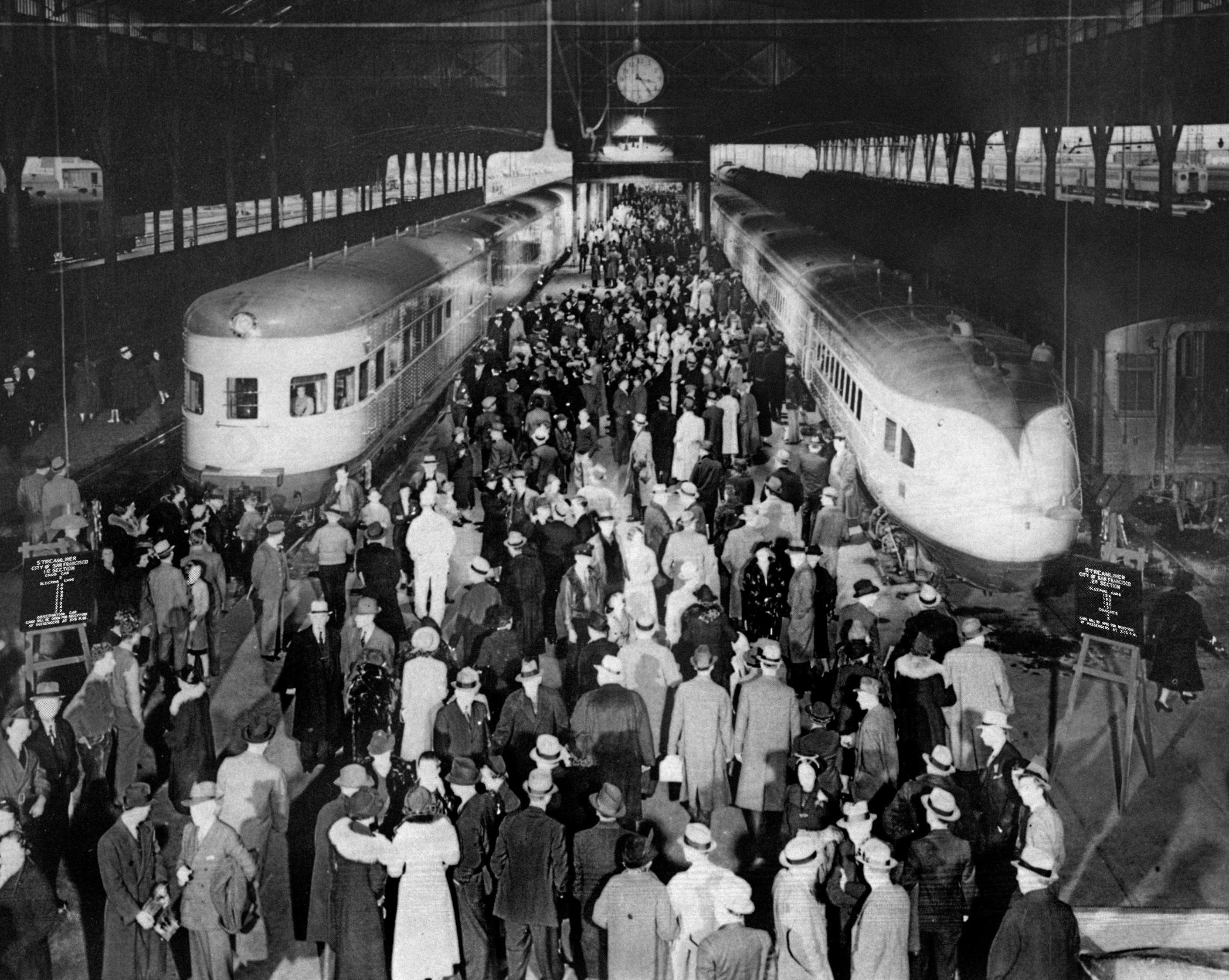 City of San Francisco  joint run of original and new train sets January 2, 1938. Original caption: ""CITY OF SAN FRANCISCO" streamliner left Oakland Pier terminal in two sections on January 2, 1938, when the new ultra-modern 17-car train was inaugurated to supplant the original 11-car train which had been in operation since June 14, 1936, for the SP-UP-C&amp;NW between San Francisco and Chicago. Both trains carried capacity loads of holiday travelers. The original streamliner was assigned to other service after this trip."