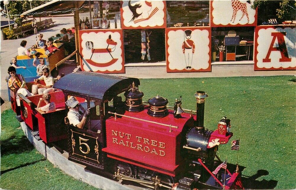 The Nut Tree Railroad train leaving the colorful Toy Shop on its way through the orchard to the Nut Tree Airport