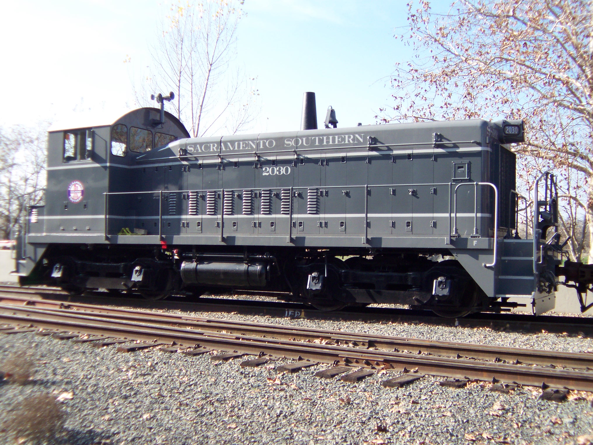 Sacramento Southern Railroad locomotive No. 2030 passes the California State Railroad Museum.