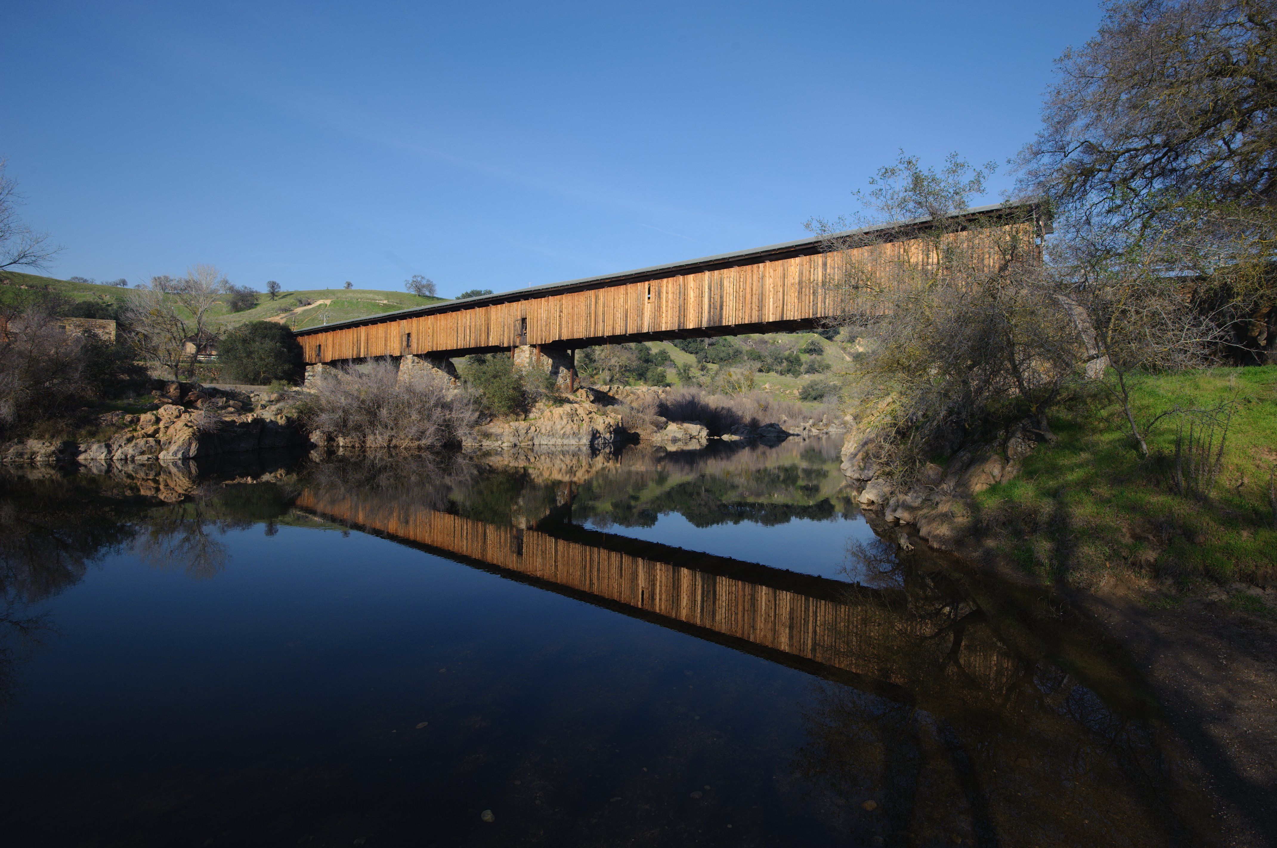 Knights Ferry covered bridge — crossing the Stanislaus River in Knights Ferry, California.
The longest covered bridge west of the Mississippi River, at 330 feet (100 m) in length.
A California Historical Landmark, and a Knights Ferry Historic District contributing property on the National Register of Historic Places.
