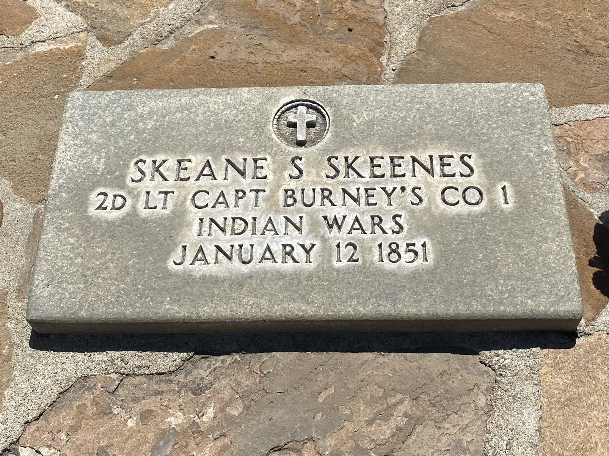 Skeane S. Skeenes (1851) grave marker in the Oakhill Cemetery. Skeenes was the first militia member to be killed in action in the conflict between white settlers and Native Californians that became known as the Mariposa War. He was buried near the battlefield by his comrades and moved to this site in nearby Oakhurst, California in 1970.