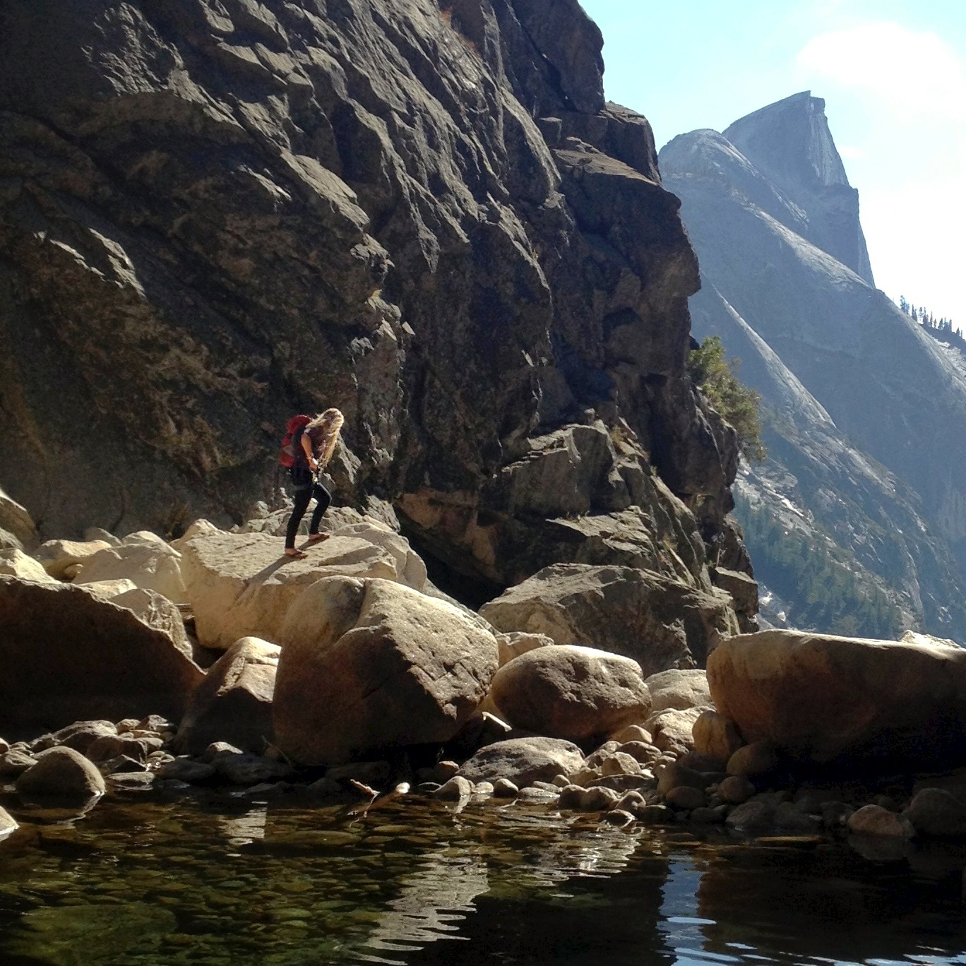 As the five of us hiked through the canyon, backpacks full of gear and survival necessities, a small group of three folks passed us carrying practically no gear at all. The group's leader, an off duty ranger, carried the one bag full of rope and repelling gear. She did the full hike in sandals. You can see her in the pic above, along with the peak of Half Dome in the background (which is about a 3.5 miles from our campground).