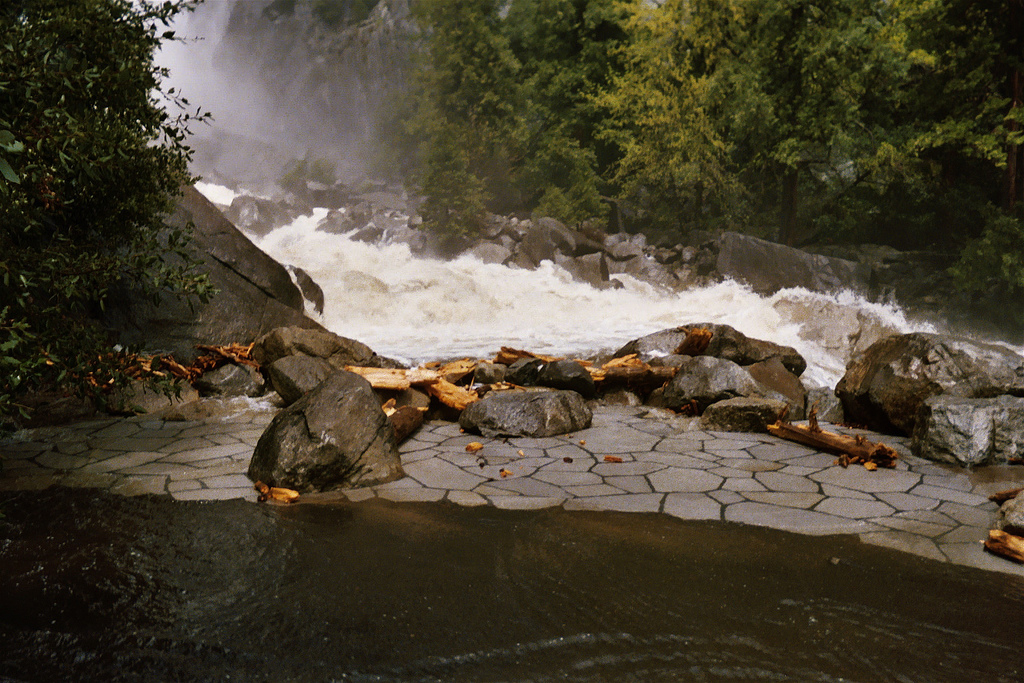 Yosemite Creek near the base of Lower Yosemite Falls, in Yosemite Valley,  Yosemite National Park, California. The water is flowing over the observation deck during the May 2005 flood.