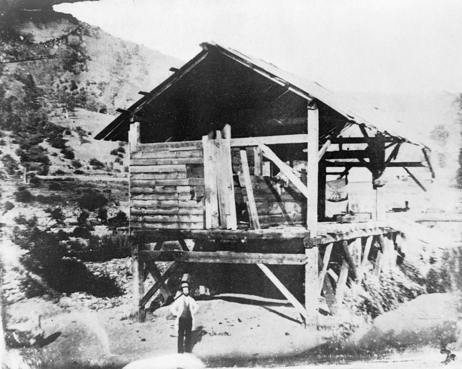 "Photomechanical reproduction of the 1850(?) daguerreotype by R. H. Vance shows James Marshall standing in front of Sutter's sawmill, Coloma, California, where he discovered gold."
Person depicted is most likely not actually Marshall.