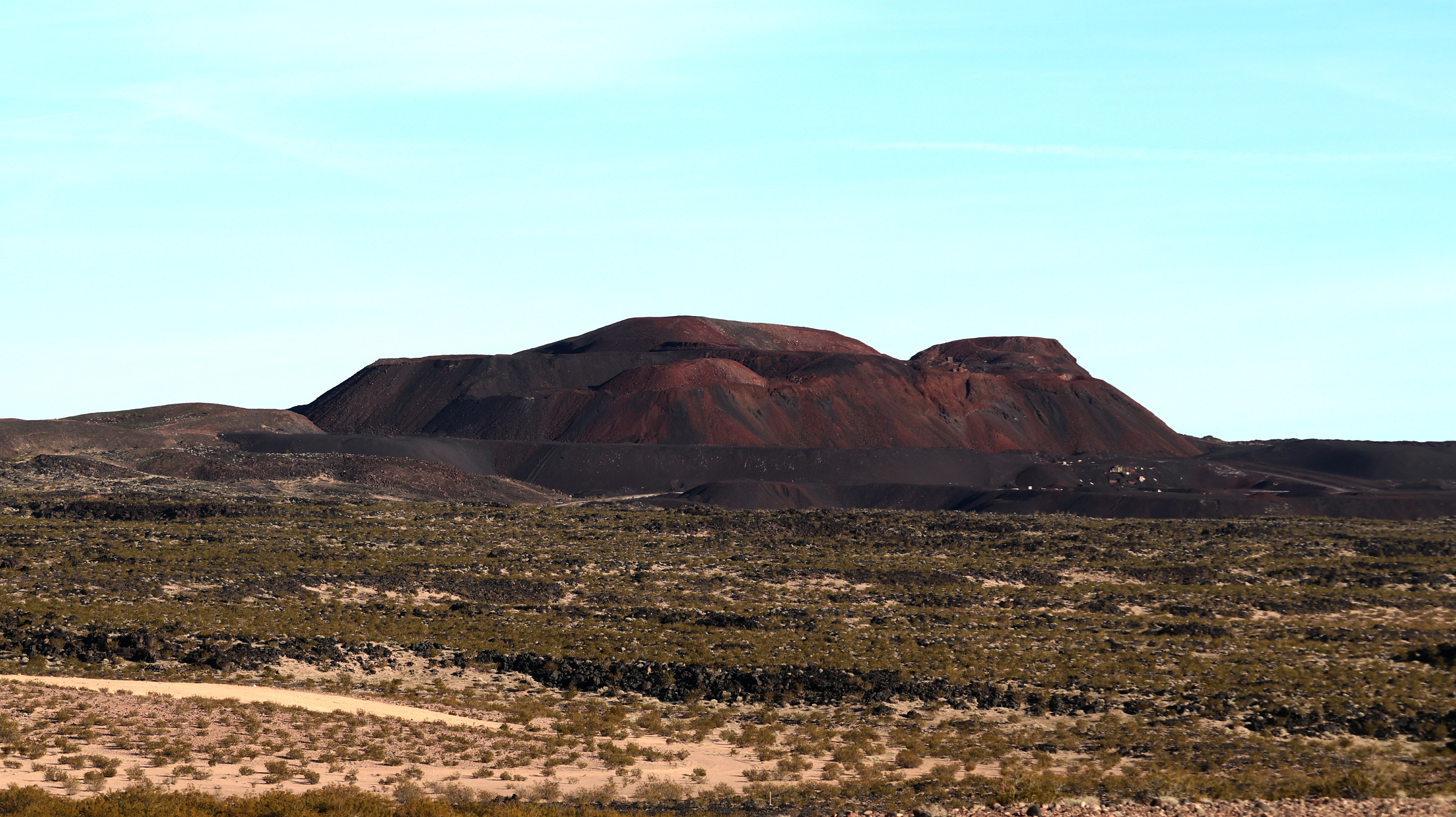 Pisgah crater/cinder cone is directly south of alongside route 66 and is 10 miles west of Ludlow California and about 30 miles southeast of Barstow California. The volcanic cone and basalt field is directly against an ancient ice age lake "Lavic Lake" The entire southern area of the cone and beyond is a marine corps gunnery range.