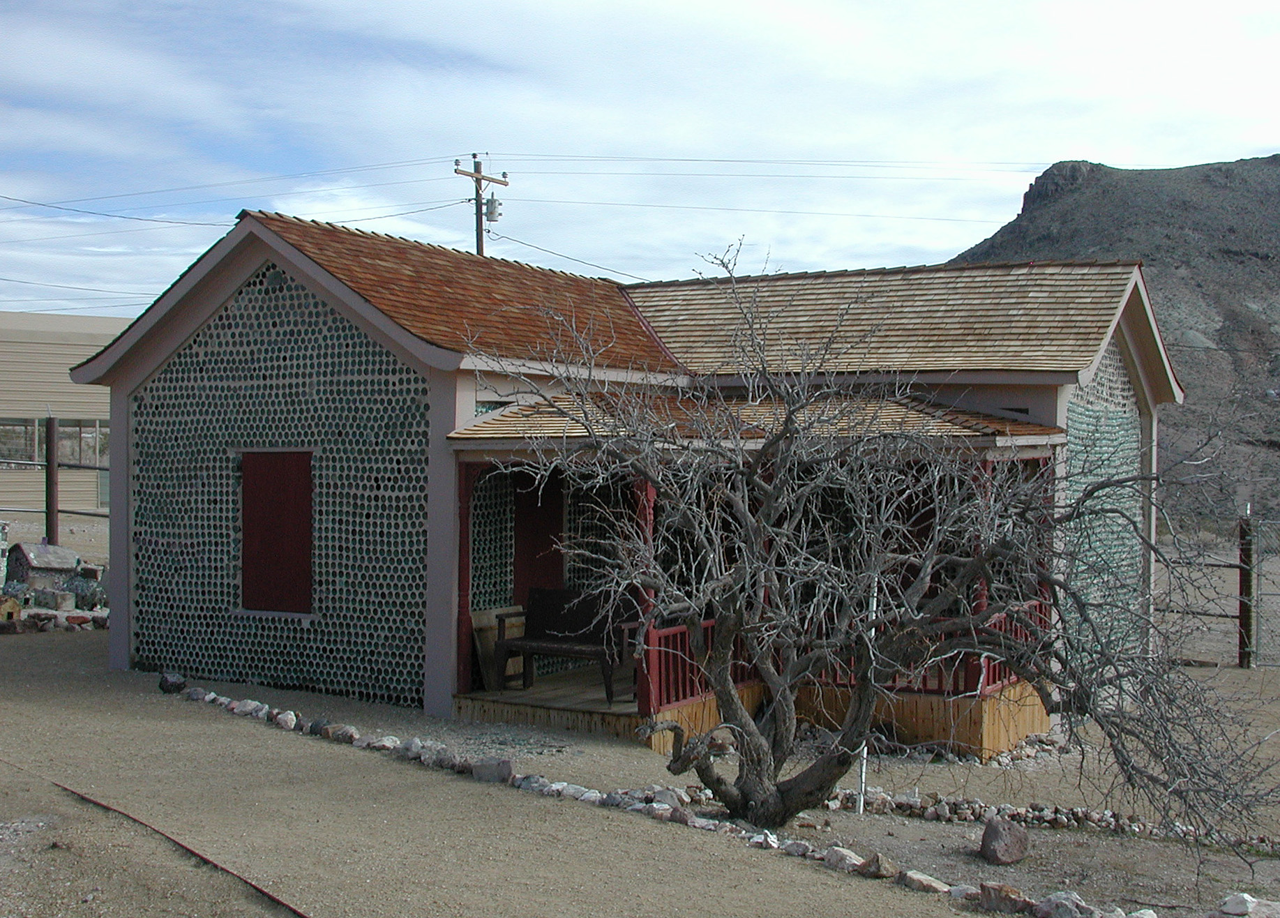 Tom Kelly's Bottle House in the ghost town of Rhyolite, Nevada, looking east
