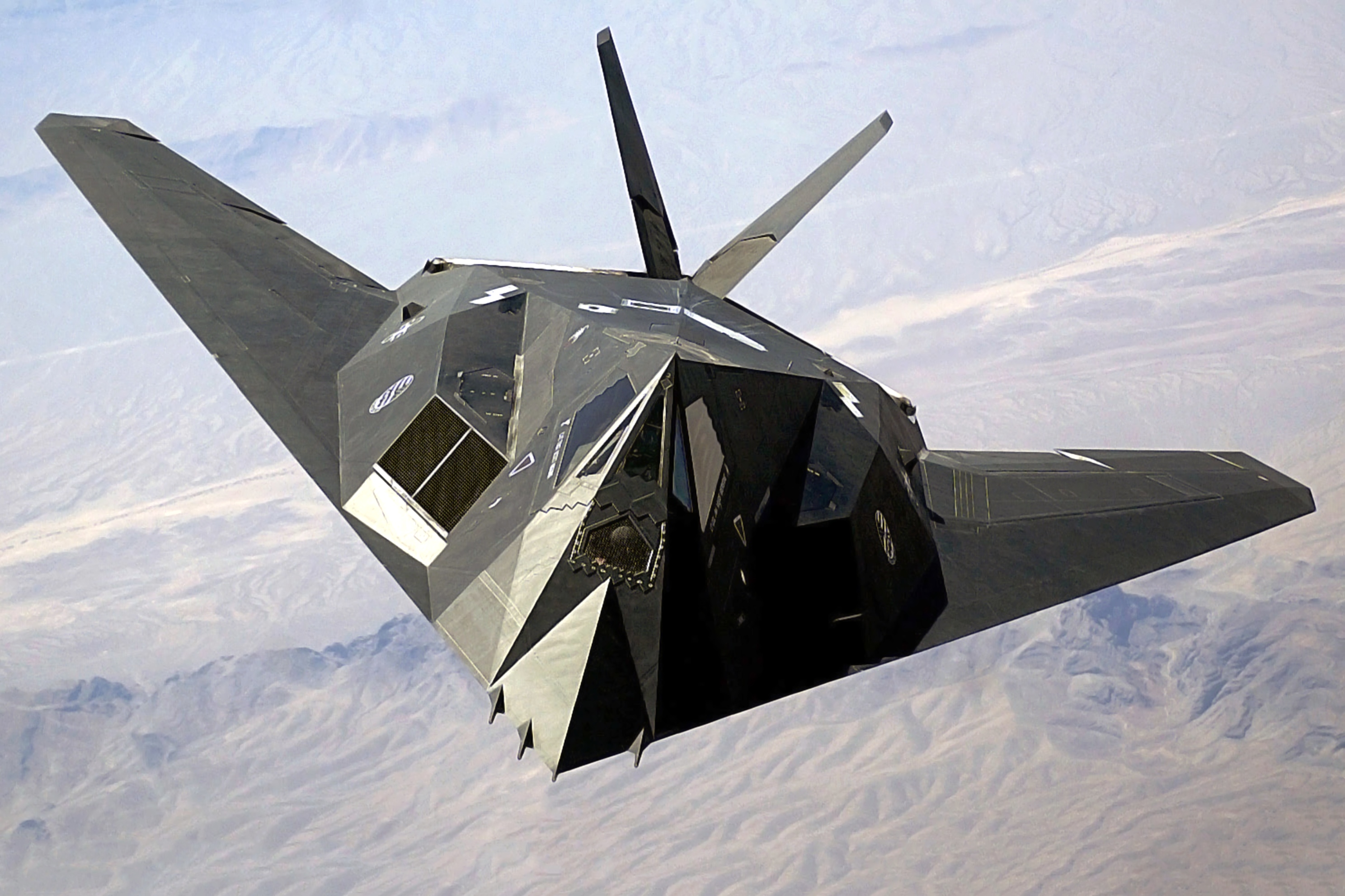 A US Air Force (USAF) F-117A Nighthawk Stealth Fighter aircraft flies over Nellis Air Force Base (AFB), Nevada (NV), during the joint service experimentation process dubbed Millennium Challenge 2002 (MC02). Sponsored by the US Joint Forces Command (USJFCOM), the MC02 experiment explores how Effects Based Operations (EBO) can provide an integrated joint context for conducting rapid, decisive operations (RDO).