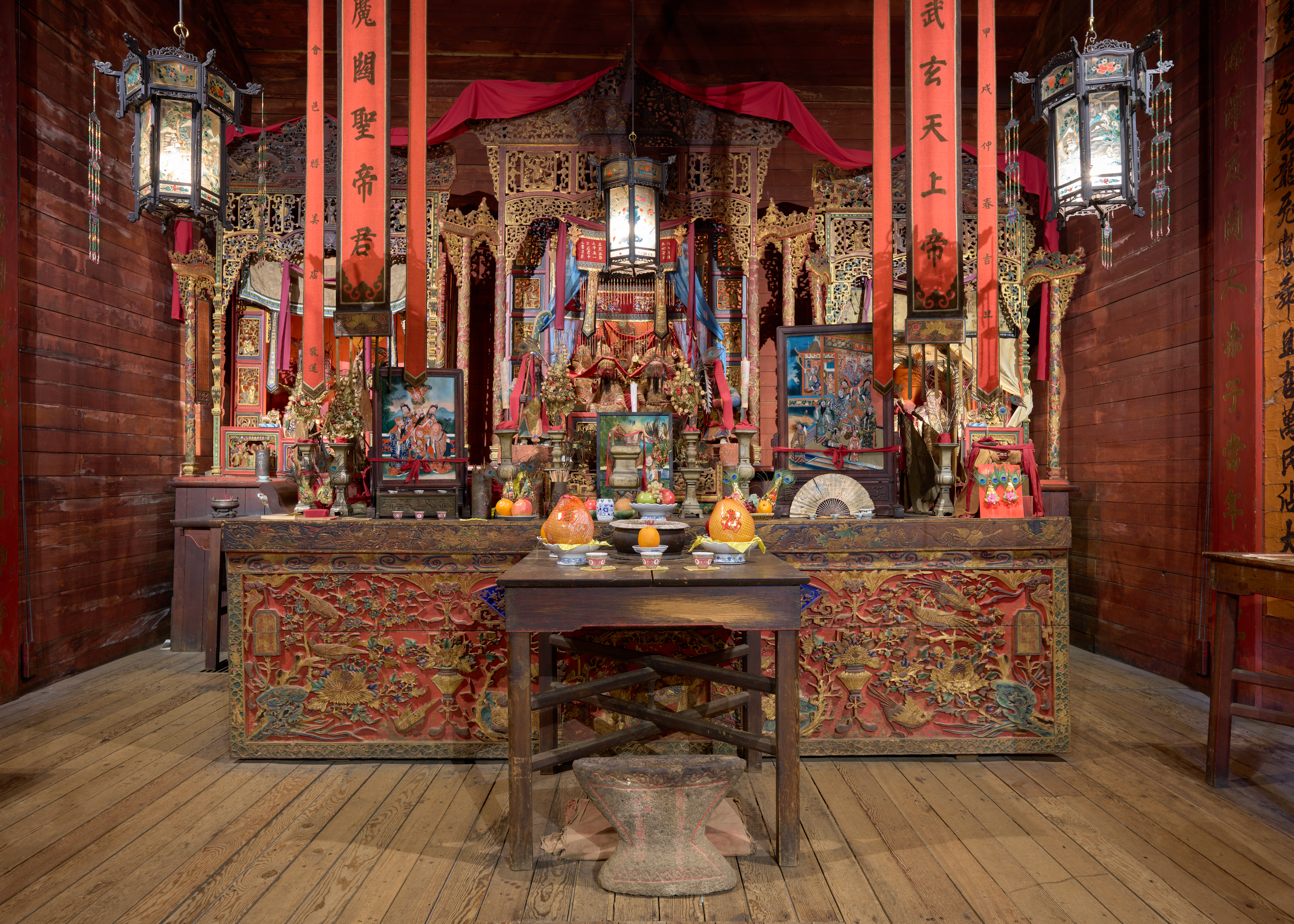 Interior of the Taoist temple 雲林廟 (The Temple among the Forest beneath the Clouds) at the Joss House State Historic Park in Weaverville, California, on May 11, 2025. This is the oldest wooden Chinese temple still in use in California. It was built in 1874 to replace an earlier structure from 1853 which had been destroyed by fire.