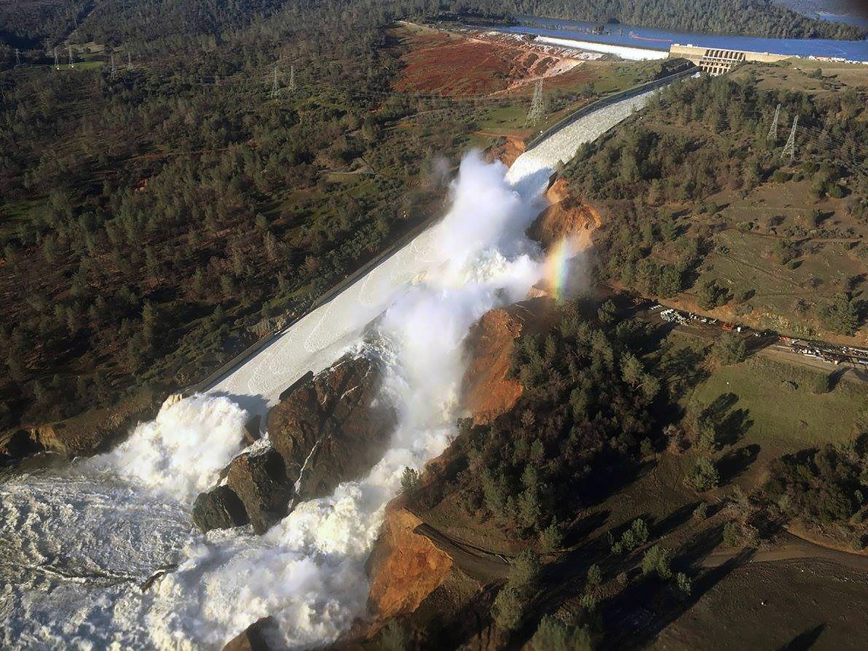 Water flowing from the eroded overflow spillway of Oroville Dam, CA.