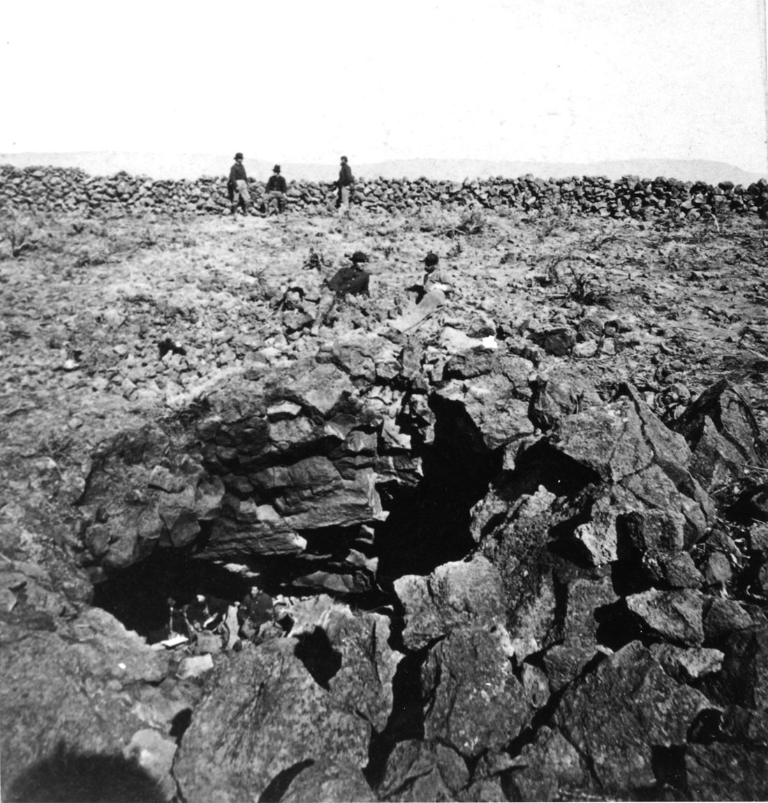 U.S. soldiers inspect Captain Jack's cave in the Lava Beds in 1873 (165-MS-2).