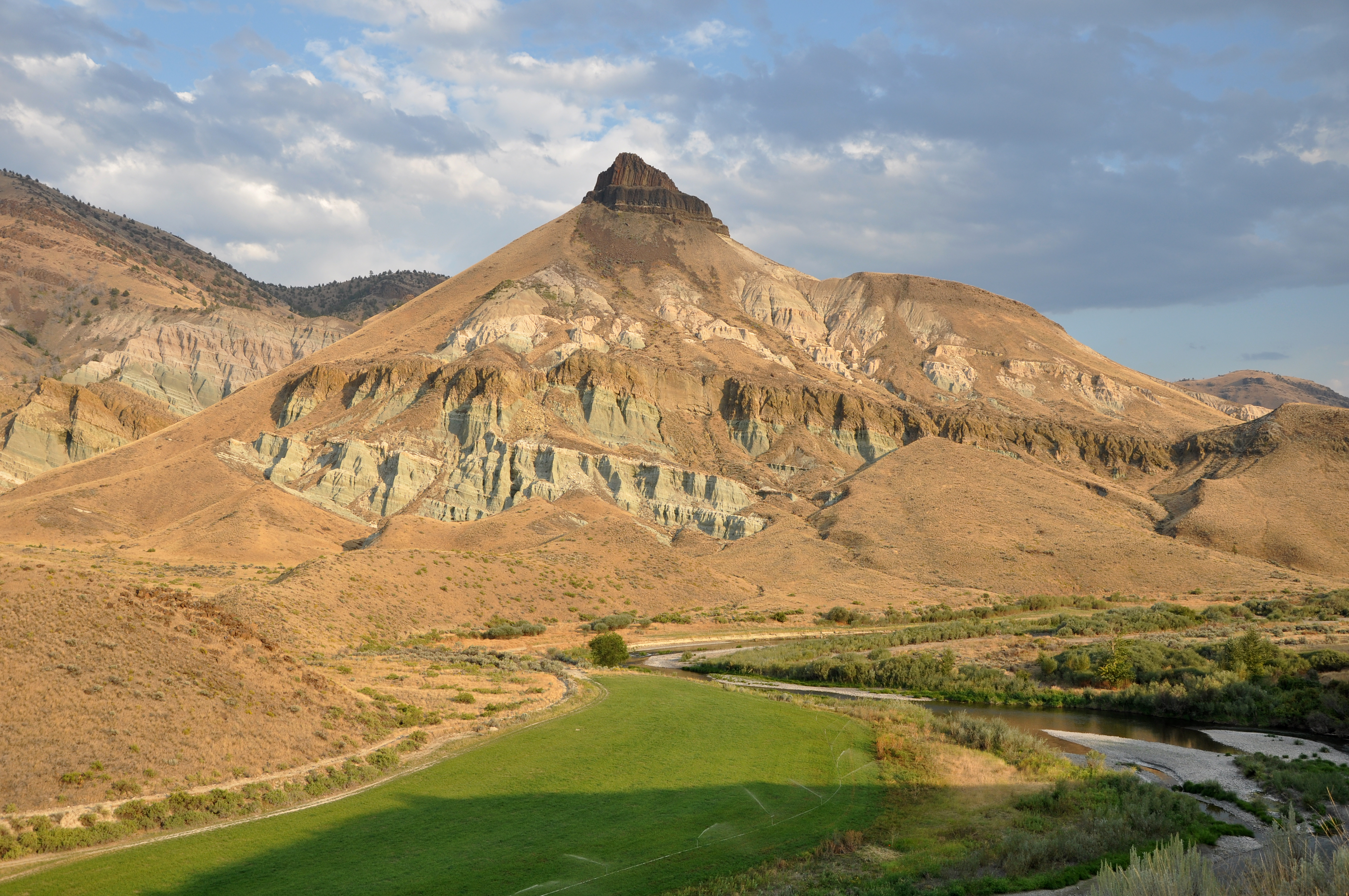 Sheep Rock in the Sheep Rock Unit of the John Day Fossil Beds National Monument in the U.S. state of Oregon. Taken from the Sheep Rock Overlook Trail near sunset.