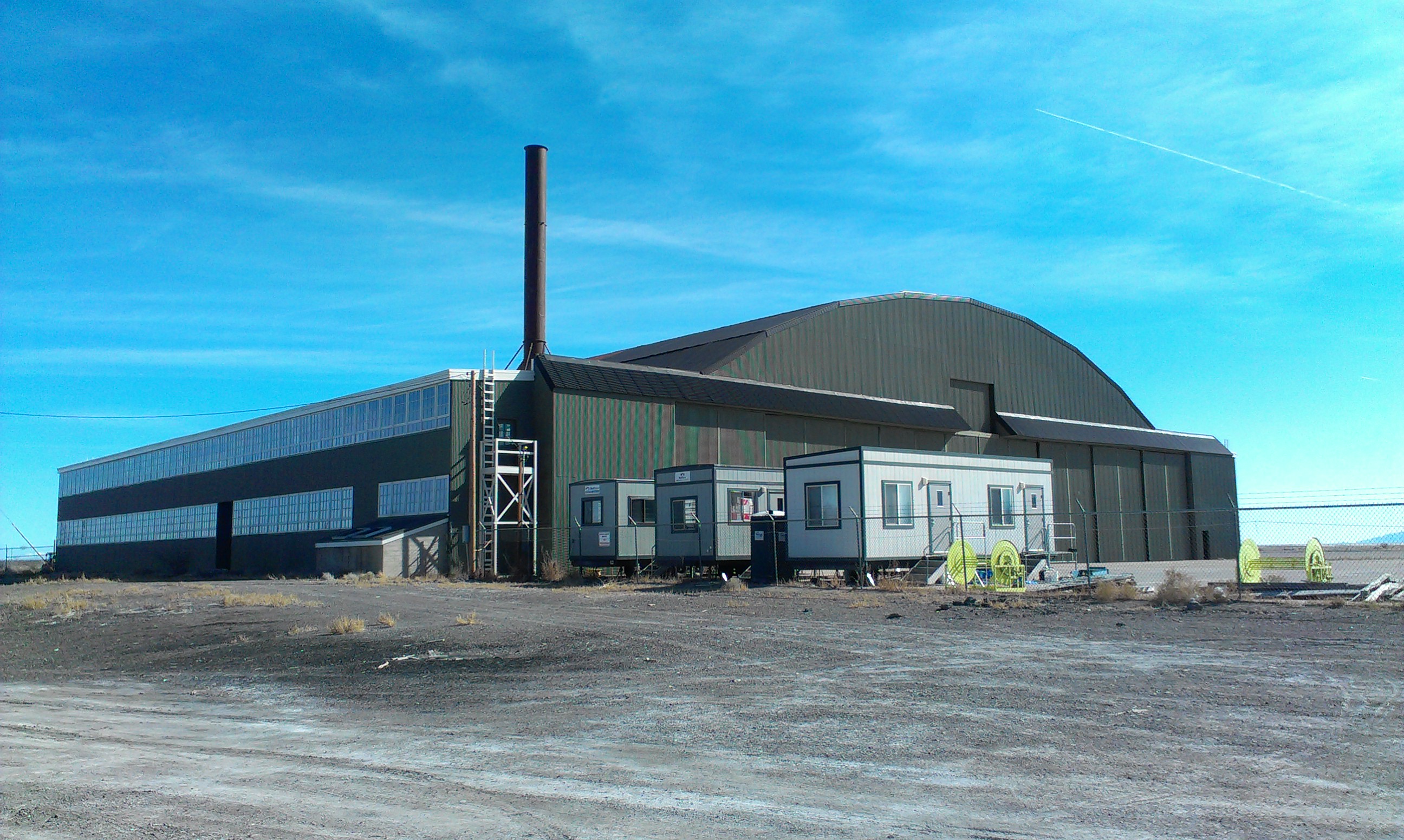 The partially restored Enola Gay Hangar from World War II, viewed from the northwest.