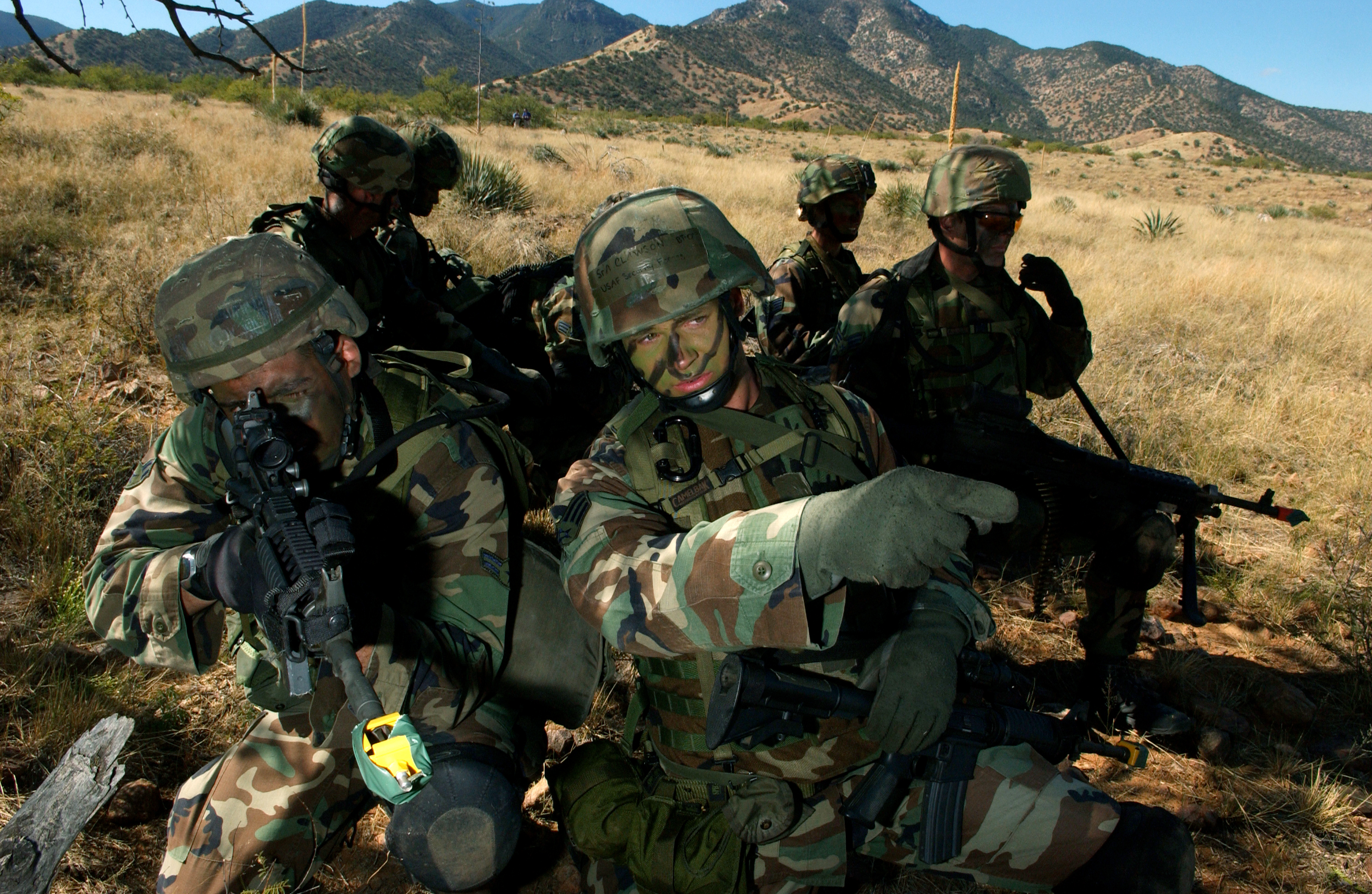 Fort Huachuca, Arizona -- Senior Airman Chris Clawson points out direction of a truck seen on a ridgeline during a tactics training reconnaissance mission Oct. 13. Members of the U.S. Air Forces in Europe Defender Challenge team are spending three weeks here in preparation for the 2004 Defender Challenge competition. Defender Challenge held at Lackland Air Force Base, Texas, is a security forces competition pitting competitors from major commands against one another. Airman Clawson is assigned to the 39th Security Forces Squadron, Incirlik Air Base, Turkey. (U.S. Air Force photo by Tech. Sgt. Justin D. Pyle)