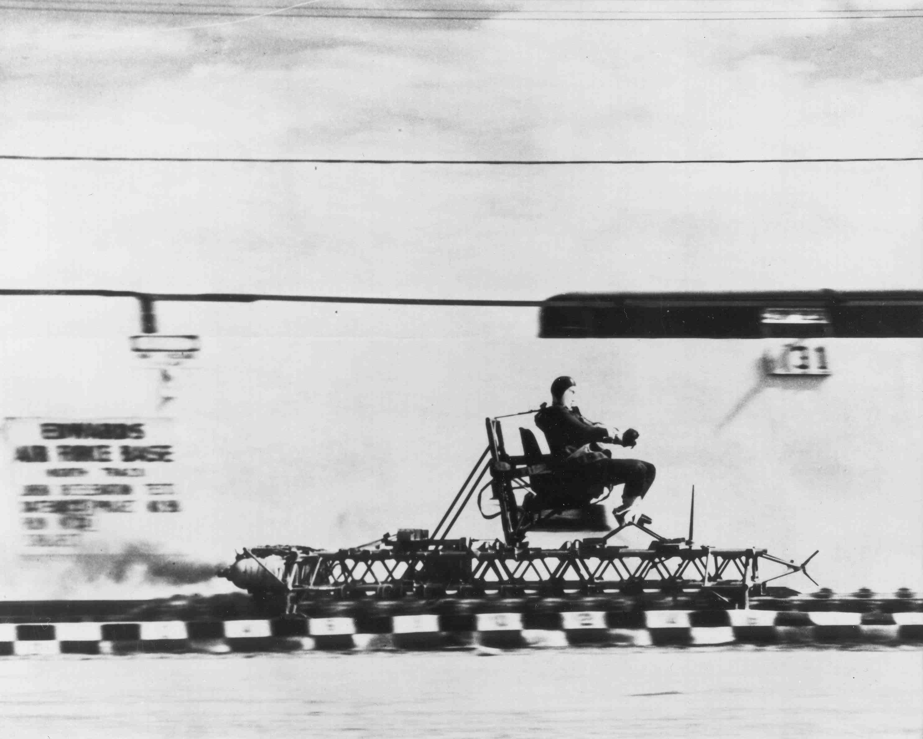Lt. Col. John Stapp rides a rocket sled at Edwards Air Force Base.
