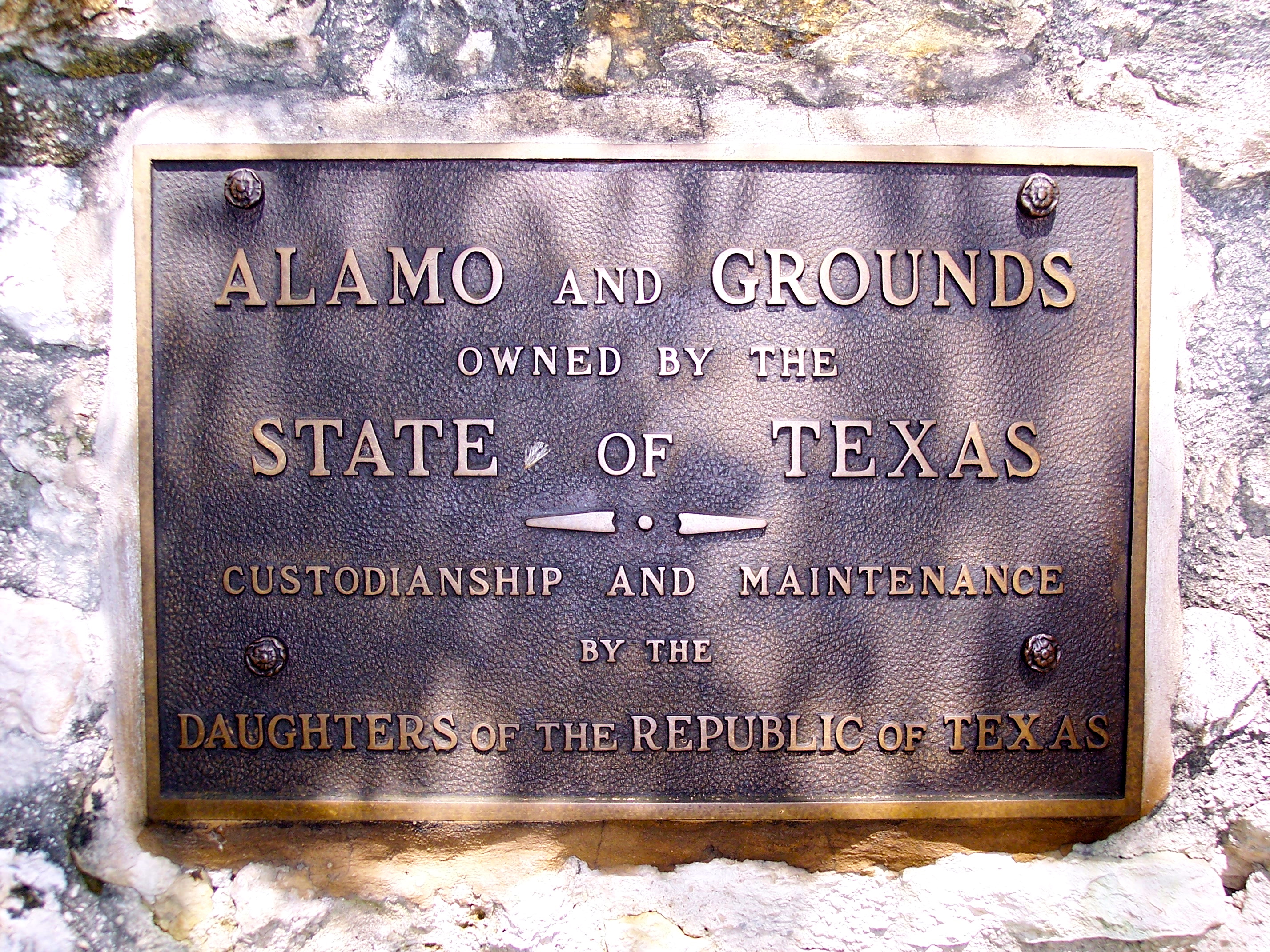Plaque on a wall at the Alamo, recognizing ownership by the state of Texas and custodianship of the Daughters of the Republic of Texas.
