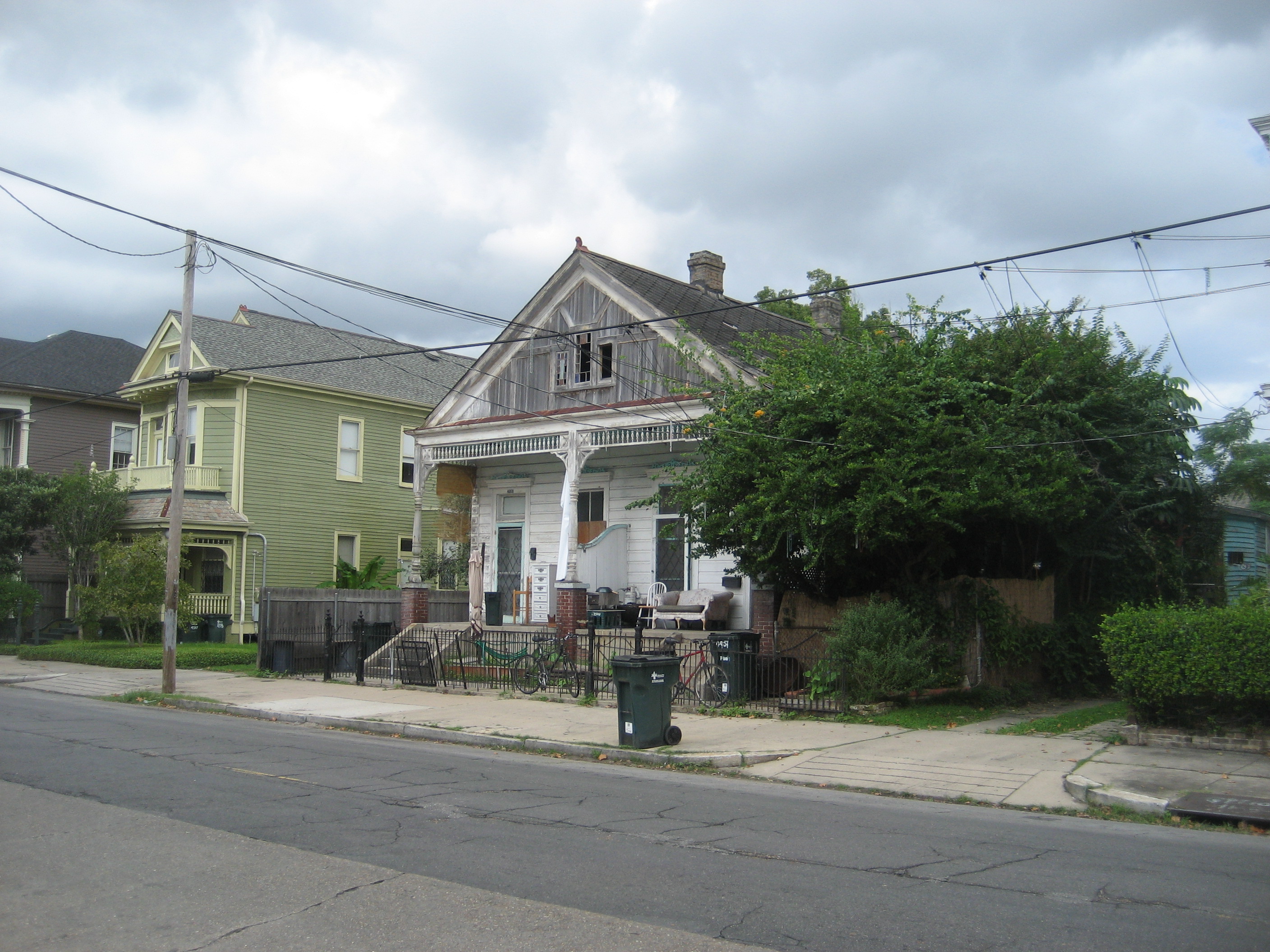 Magazine Street, Uptown New Orleans.  4900 block, lake side. In 1963 Lee Harvey Oswald and his wife Marina lived in an apartment on the right side of this building (in wing almost completely obscured by fence and foliage), renting from landlord Jessie James Garner.