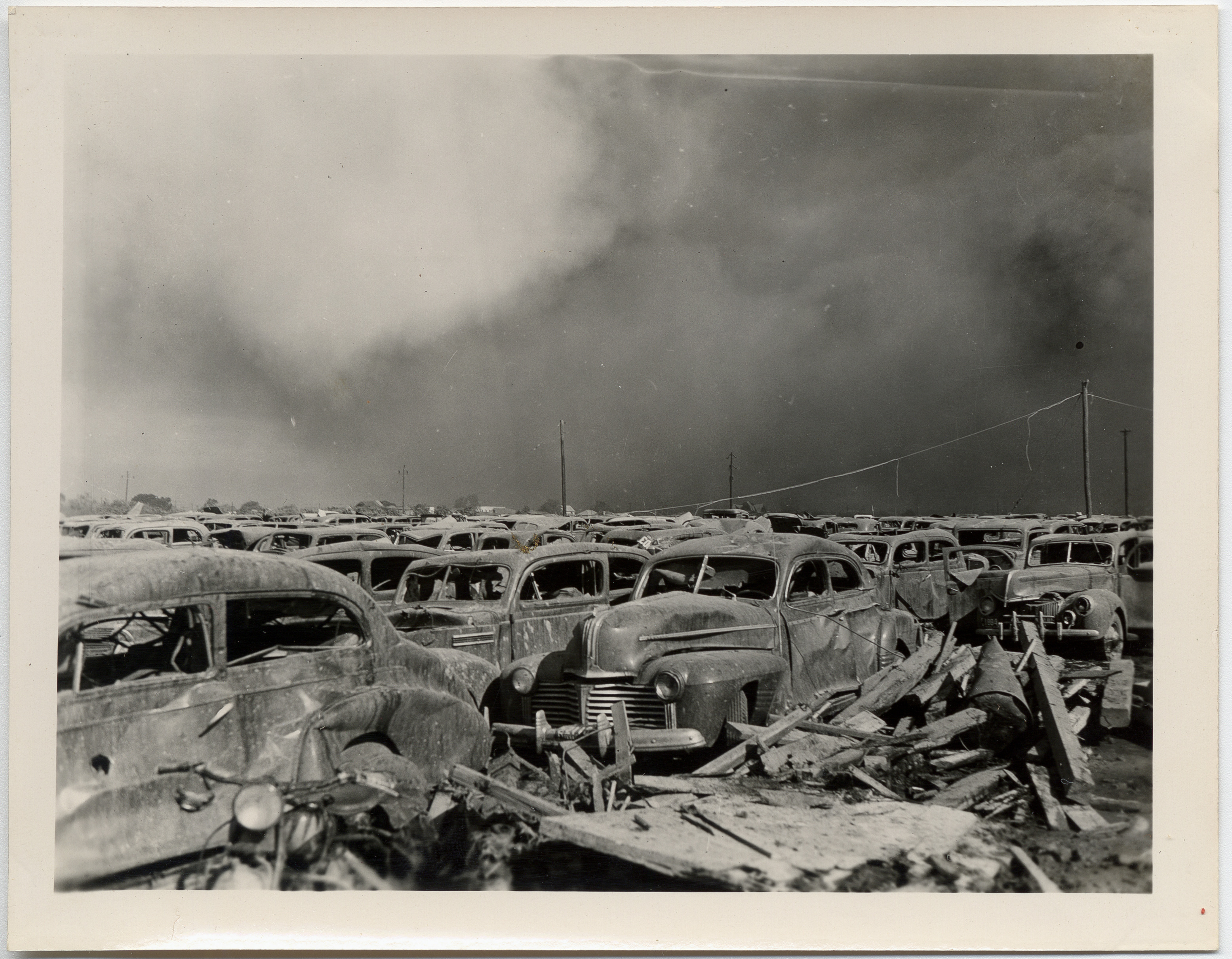 Texas City disaster. Parking lot 1/4 of a mile away from the explosion.Courtesy of Special Collections, University of Houston Libraries. To visit the entire collection at the University of Houston Digital Library please visit: http://digital.lib.uh.edu/cdm4/results.php?CISOOP1=exact&CISOFIELD1=CISOSEARCHALL&CISOROOT=/p15195coll4&CISOBOX1=Texas+City+Disaster&CISOSTART=1,1