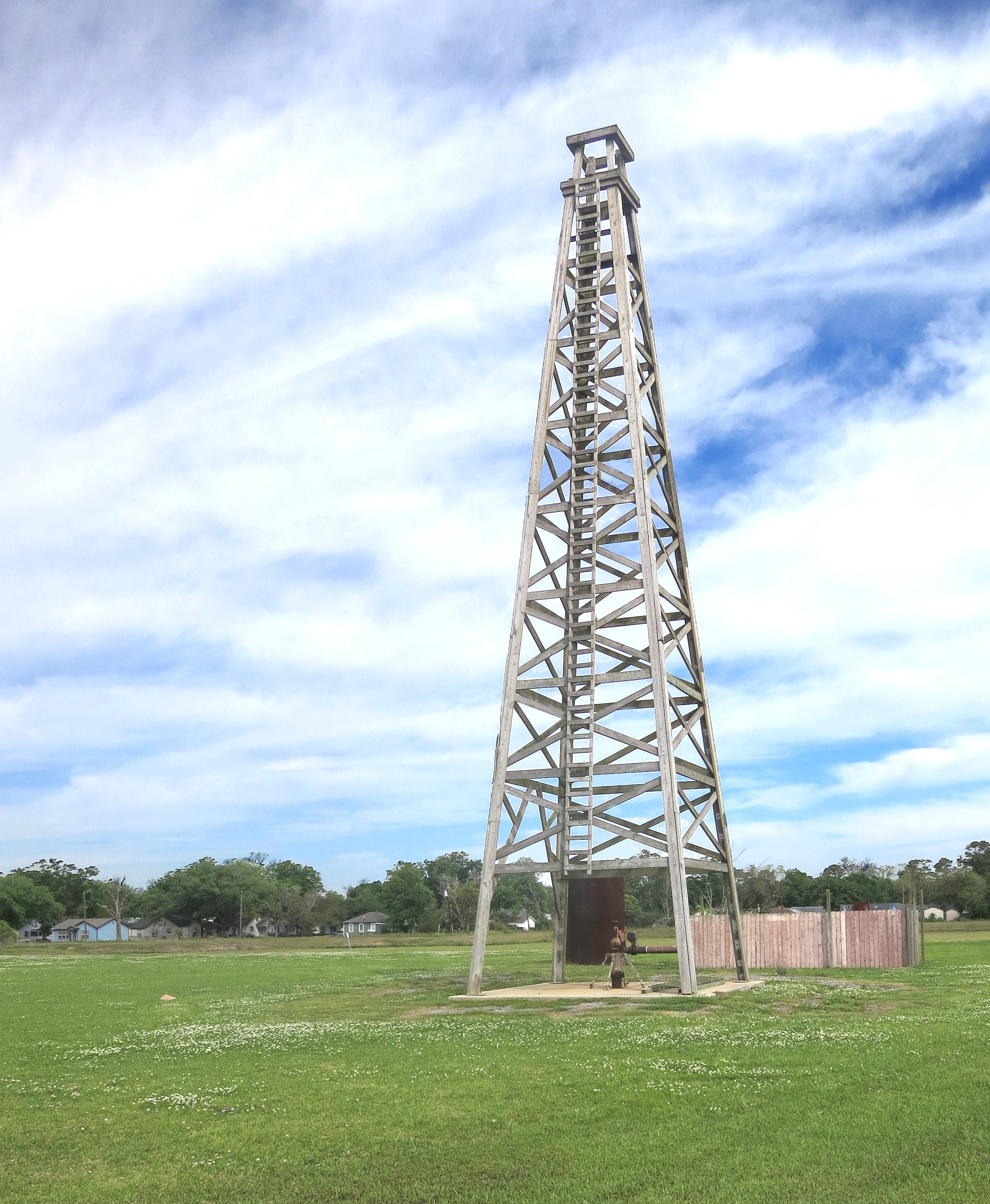Discovery well of the Spindletop Oil Field changed Texas. It was the first important well on the Gulf Coast. It blew in on Jan. 10, 1901, flowing 100,000 barrels of oil a day from a depth of 1020 feet. The oil production which resulted made Beaumont a city and Texas the major oil refining and exporting center of the world, which it still is today. The Lucas Gusher was drilled by the Hamill Brothers, contractors, under the direct supervision of Captain Anthony F. Lucas for Guffey and Galey of Pittsburgh, on the McFaddin, Weiss and Kyle lease.
This replica of Lucas' famous Spindletop gusher is not located at Spindletop Park, rather it is at Gladys City 1.5 miles away.  There is a museum, monument and somehow got the historical marker moved to this place.  I don't know the schedule but periodically they shoot a stream of water up and out the top to simulate a gusher.