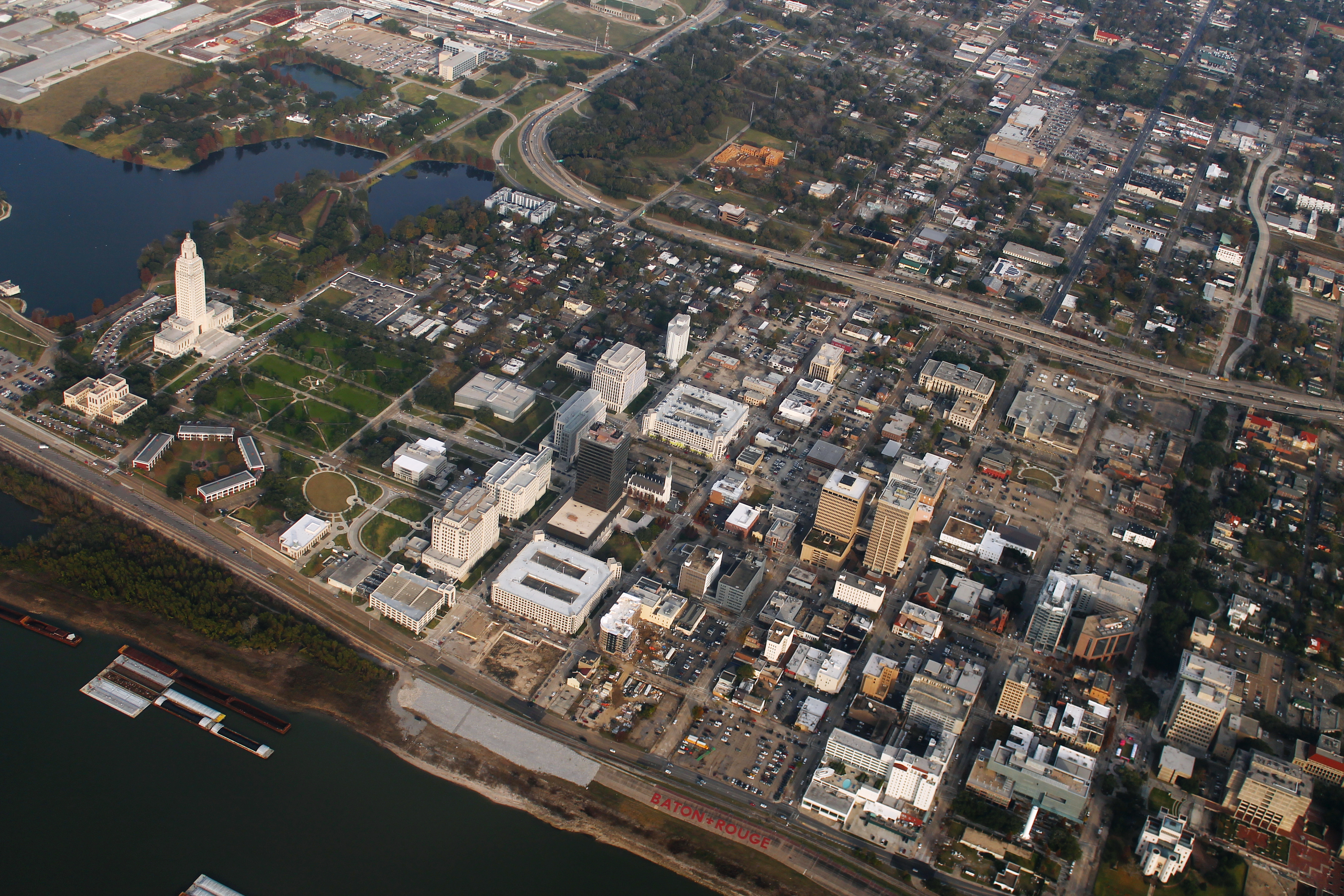 An aerial view of downtown Baton Rouge, Louisiana, including the Louisiana State Capitol at left and the Old Capitol Building at bottom right. Photo taken from N401EA after take-off from Baton Rouge Metropolitan Airport.