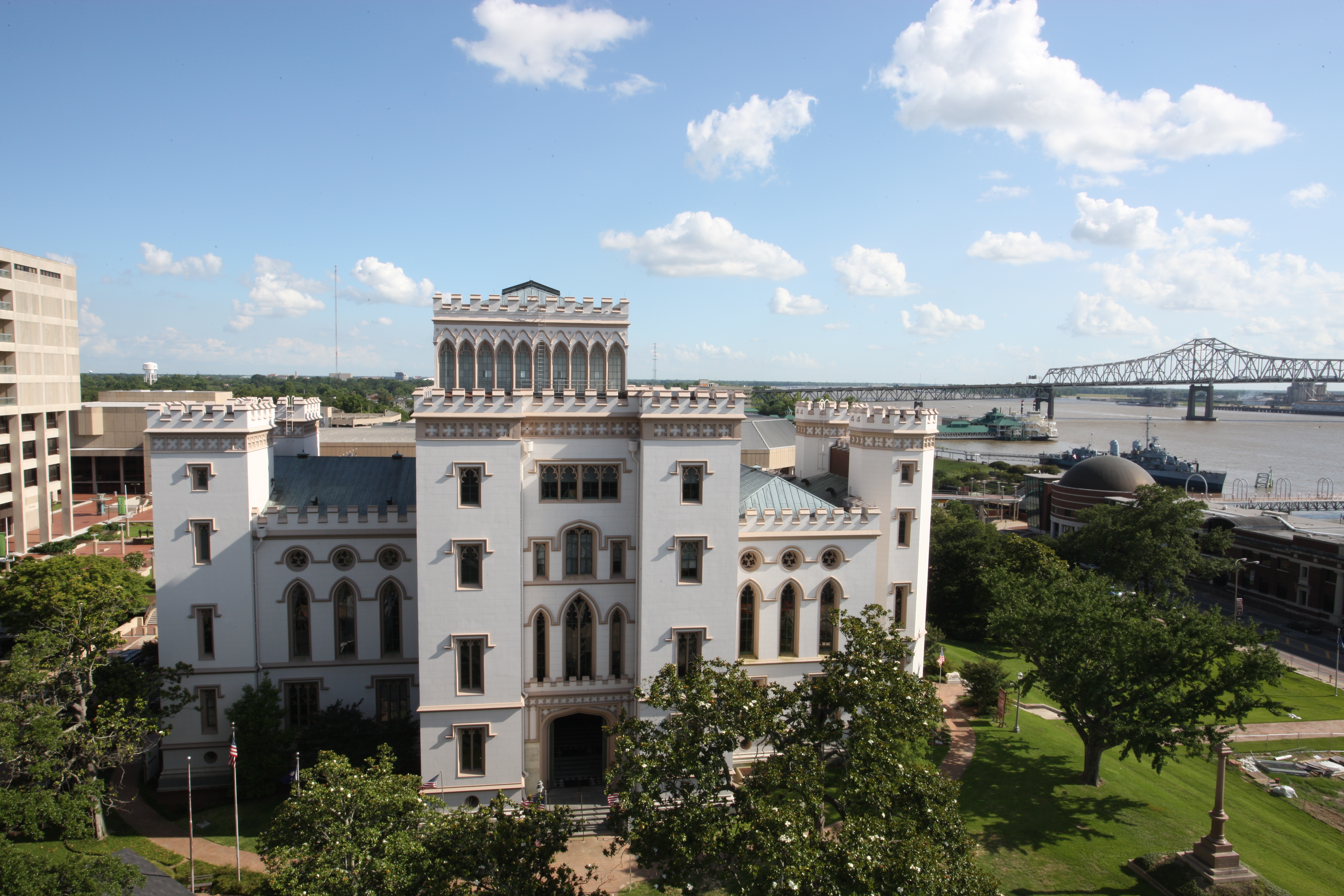 Scope and content:  The original finding aid described this photograph as:
Original Caption: The Old Louisiana State Capitol, known as a Gothic architectural treasure, stands surrounded by green trees and grass as the Mississippi River flows in the distance. The four-story white building was built to look and function like a castle.
Location: Location: Louisiana

Status: Public domain. Patrick Salisbury