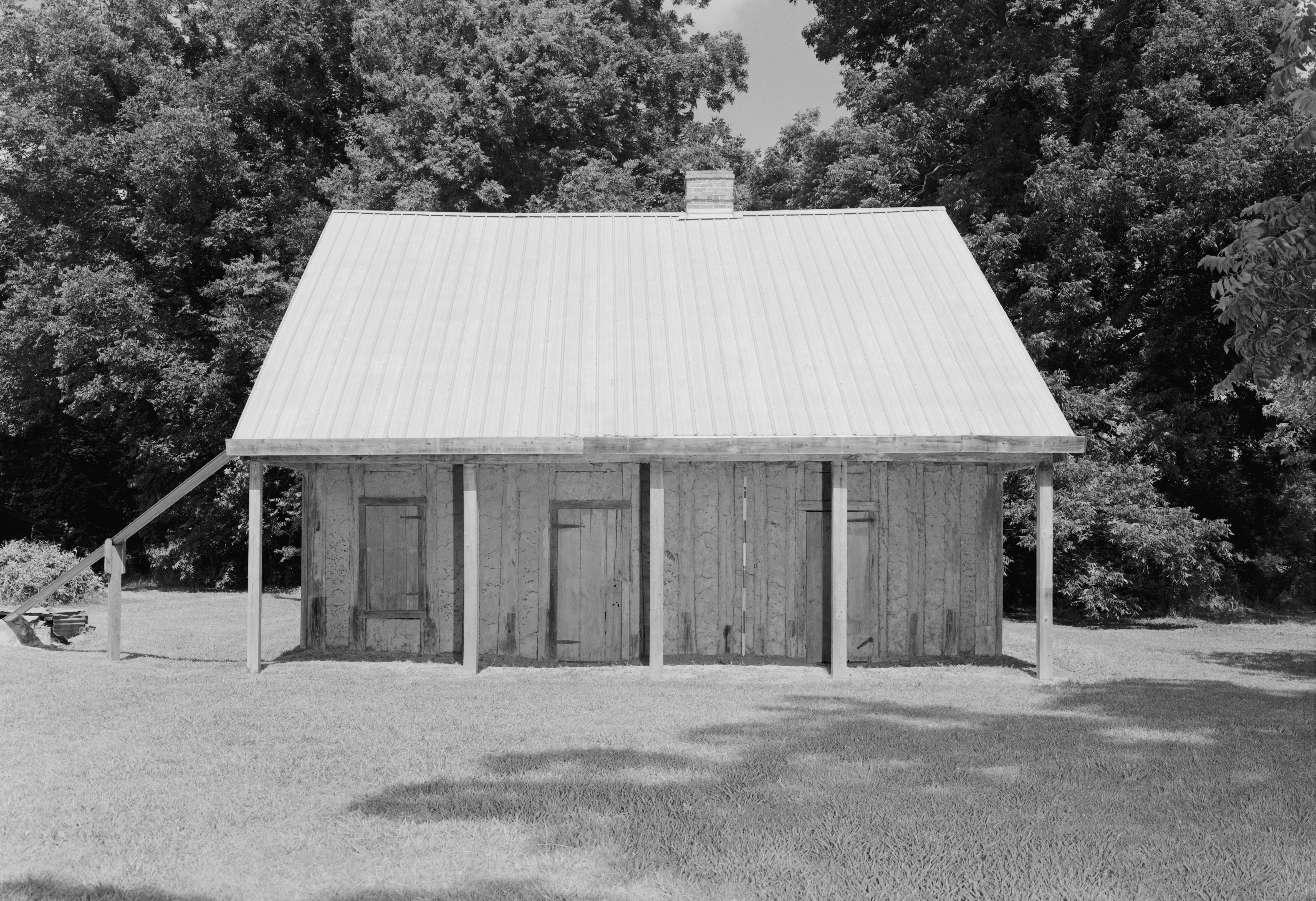 Front of the Badin-Roque House, located south of Natchez in Natchitoches Parish, Louisiana, United States. Built in 1830, it is believed to be the only known poteaux-en-terre house in the United States outside of Ste. Genevieve, Missouri, and it is listed on the National Register of Historic Places.