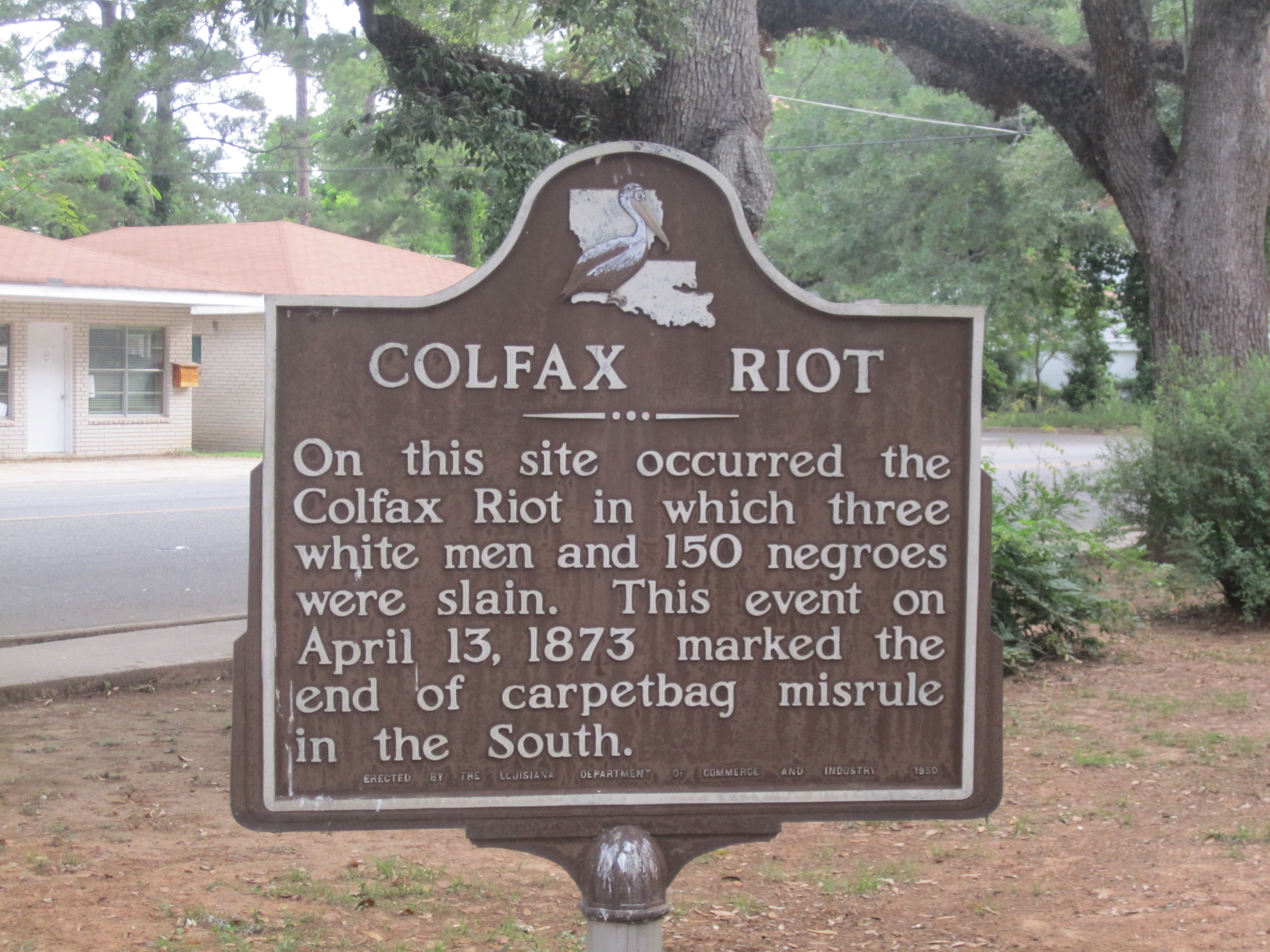 I took photo of historical marker in Colfax, LA, of Colfax Riot of 1873, using Canon camera.