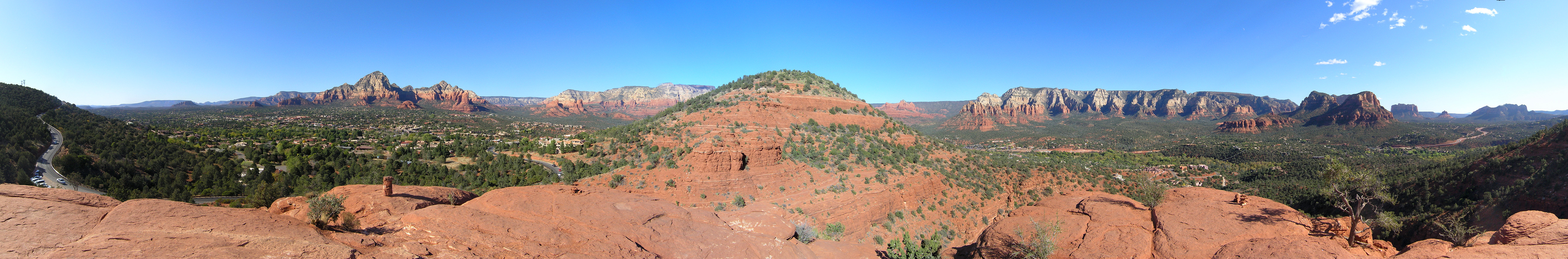 Panoramic view of Sedona from the vortex point near the Sedona airport. The famous bell rock can be seen on the right side of the photo, which is located on the south side of the vortex point. Major parts of the town are in the middle of the photo. This picture was taken by Sheng Liu in October, 2009.
