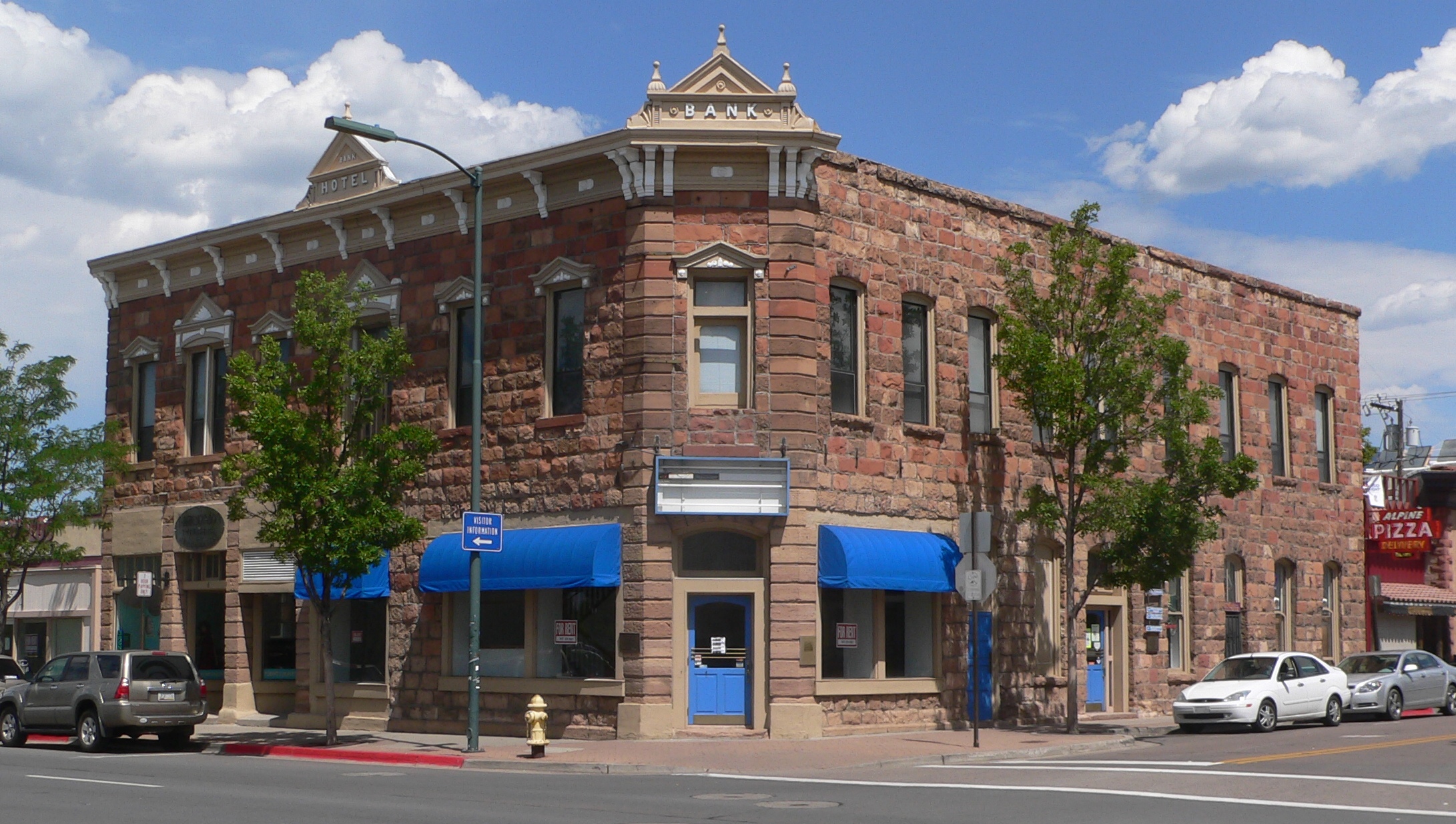 Bank Hotel, a.k.a. McMillan building, located at northwest corner of Leroux Street and Santa Fe Avenue in Flagstaff, Arizona: seen from the southeast. The car at left is on Santa Fe; the cars at right are on Leroux.