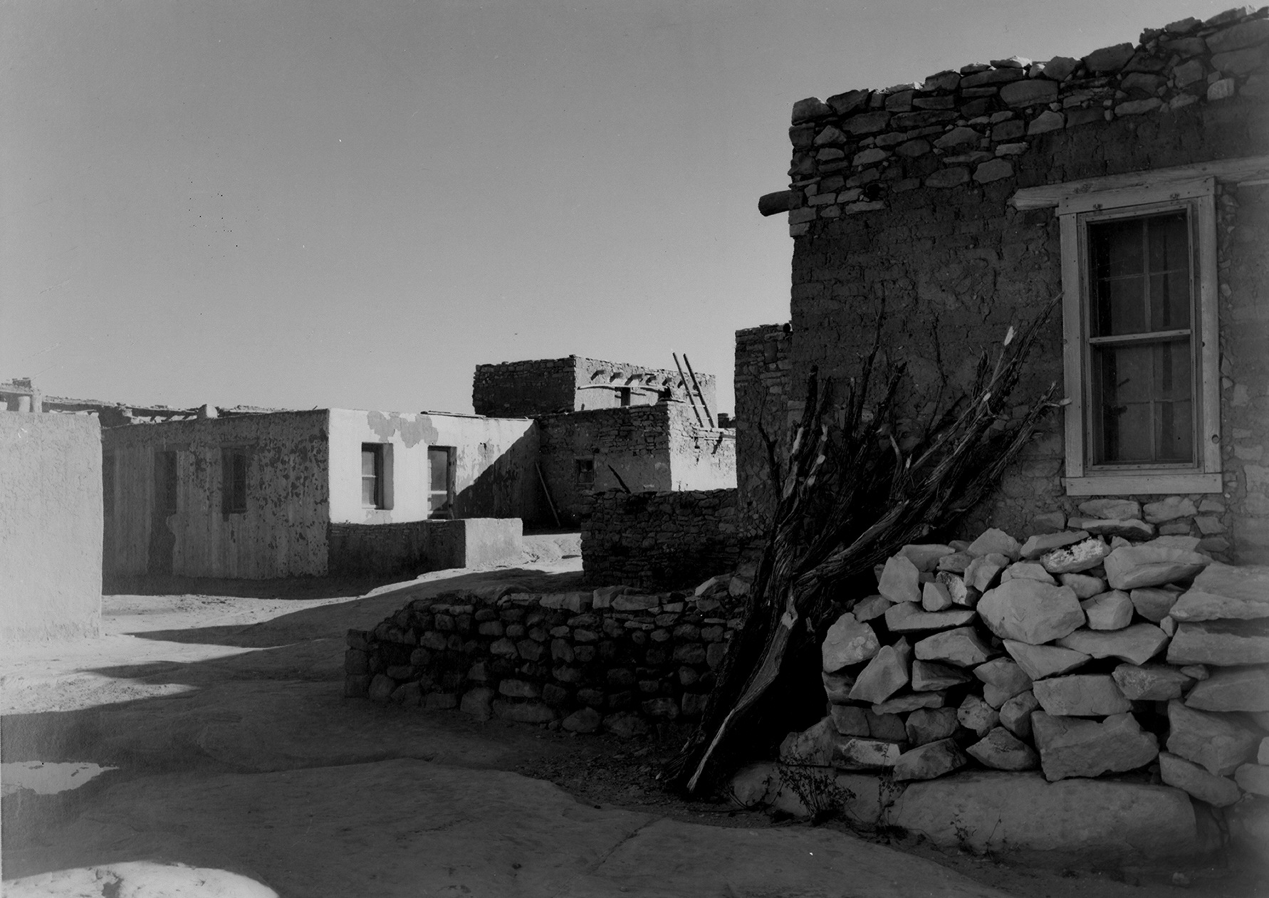 "Acoma Pueblo," looking across street toward houses.
