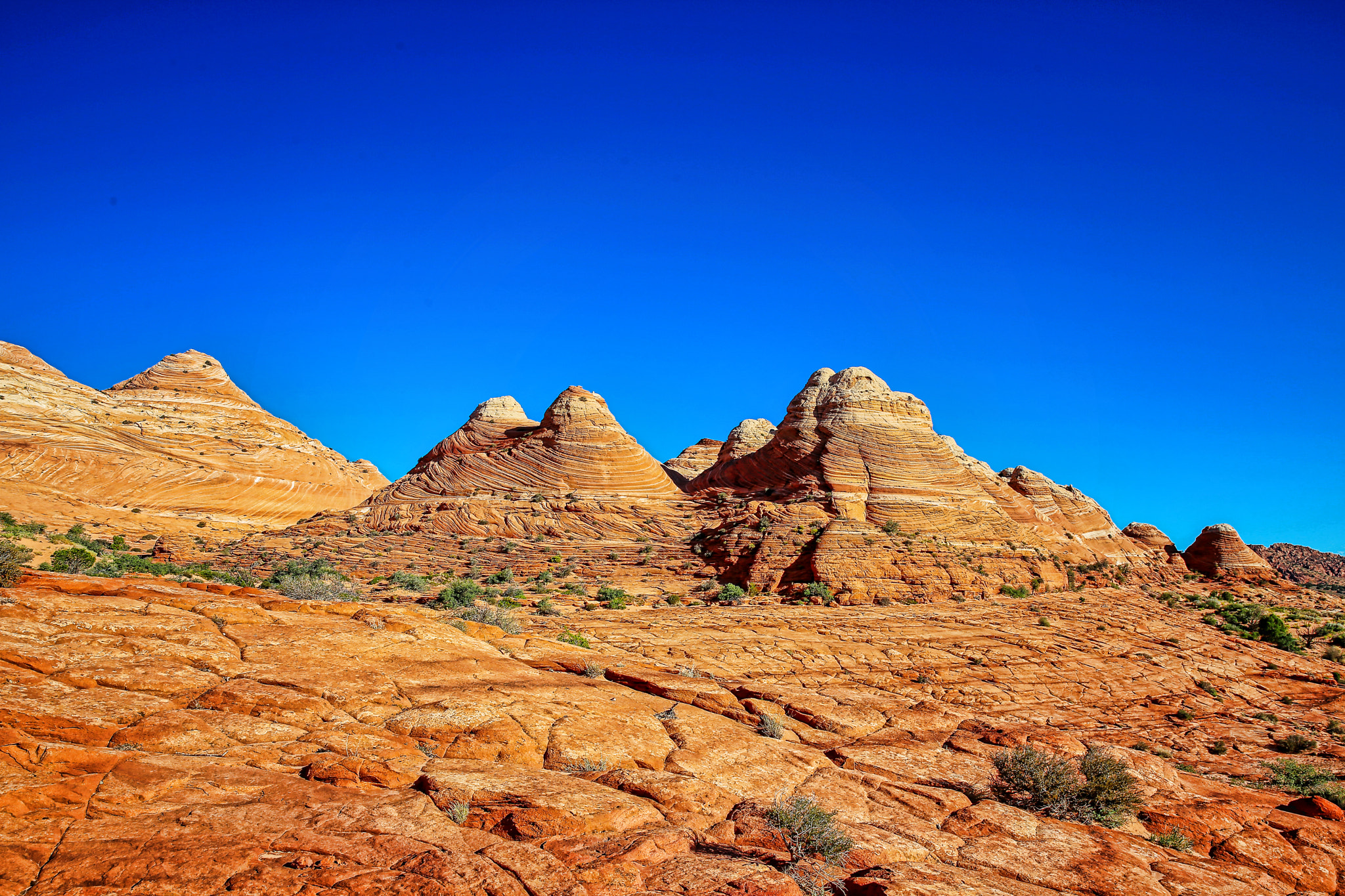 500px provided description: This was actually captured on the way back from "the Wave" - the iconic formation on the border of Utah and Arizona in the Coyote Buttes. [#Mountains ,#Arizona ,#Utah ,#Blue sky ,#Sandstone ,#Red rocks ,#The WAve]