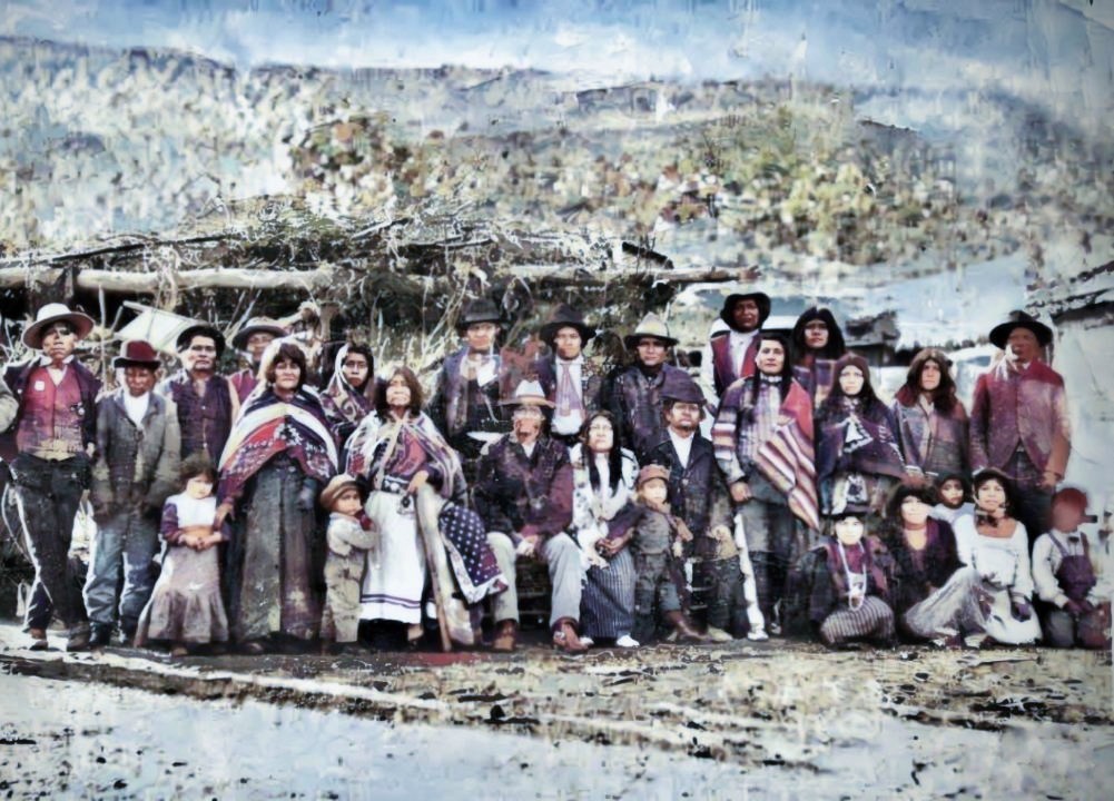 Southern Paiute Native Americans in Koosharem, Utah, February 1905. Jimmy Timmican, kneeling far right, heard the story of the Circleville Massacre from his father, John Timmican, standing with his spouse Rosey in the far back row. Jimmy’s secondhand oral account of the lynching is inscribed on the back side of stone memorial in Circleville, Utah.