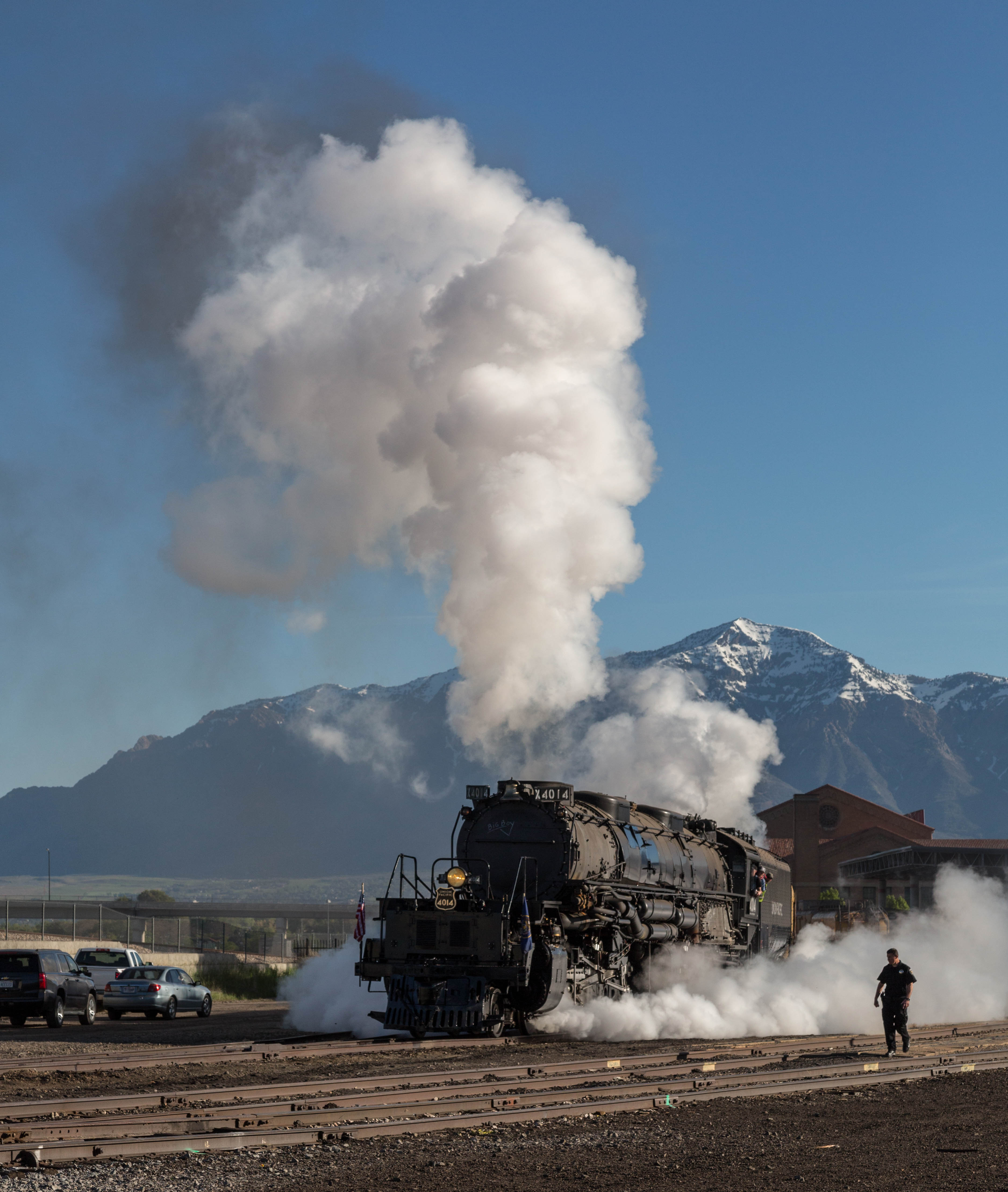 Union Pacific 4014 teamed with UP 844 take off from Ogden, Utah Union Station heading for Cheyenne, Wyoming after participating in the Golden Spike Sesquicentennial.  Security guard is keeping us all at bay.