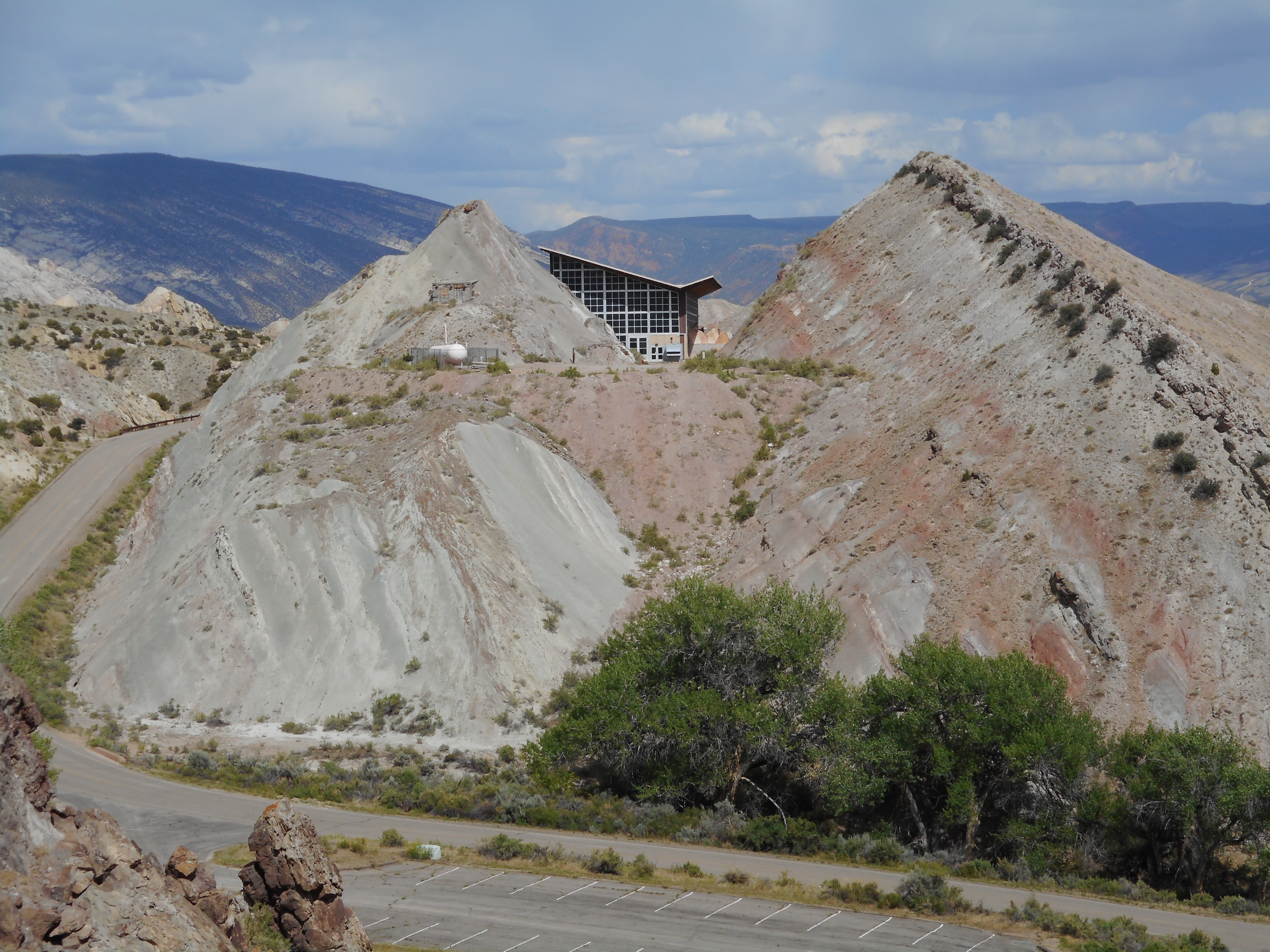 View east towards the Quarry Visitor Center at Dinosaur National Monument. The boundary between the Morrison Formation (Brushy Basin Member) and the Cedar Mountain Formation is just above the highest red bed.