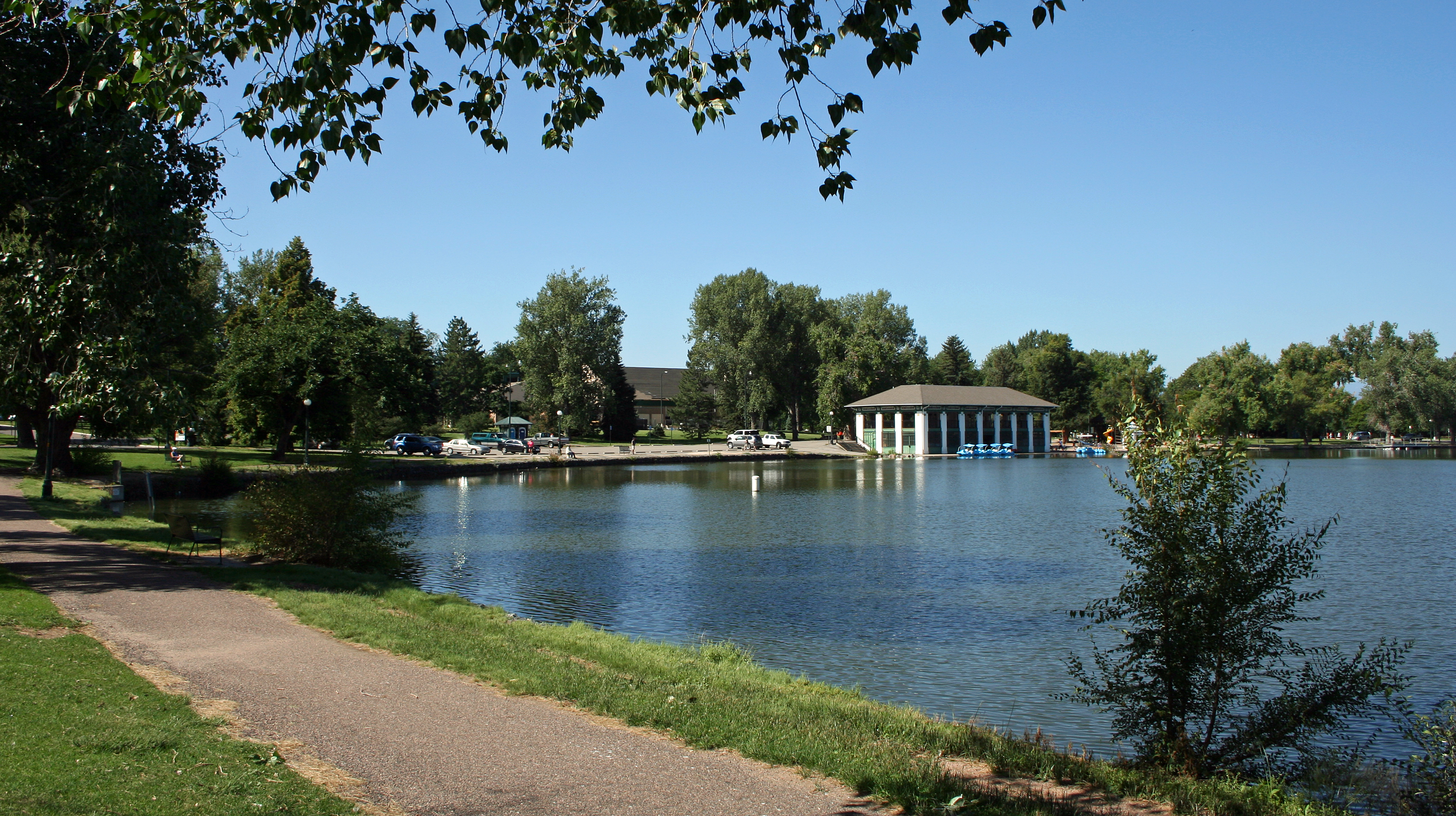 A view of Washington Park in Denver, Colorado, including Smith's lake and the 1913 Boat House. The park and the surrounding neighborhood, also called Washington Park, are listed on the National Register of Historical Places.