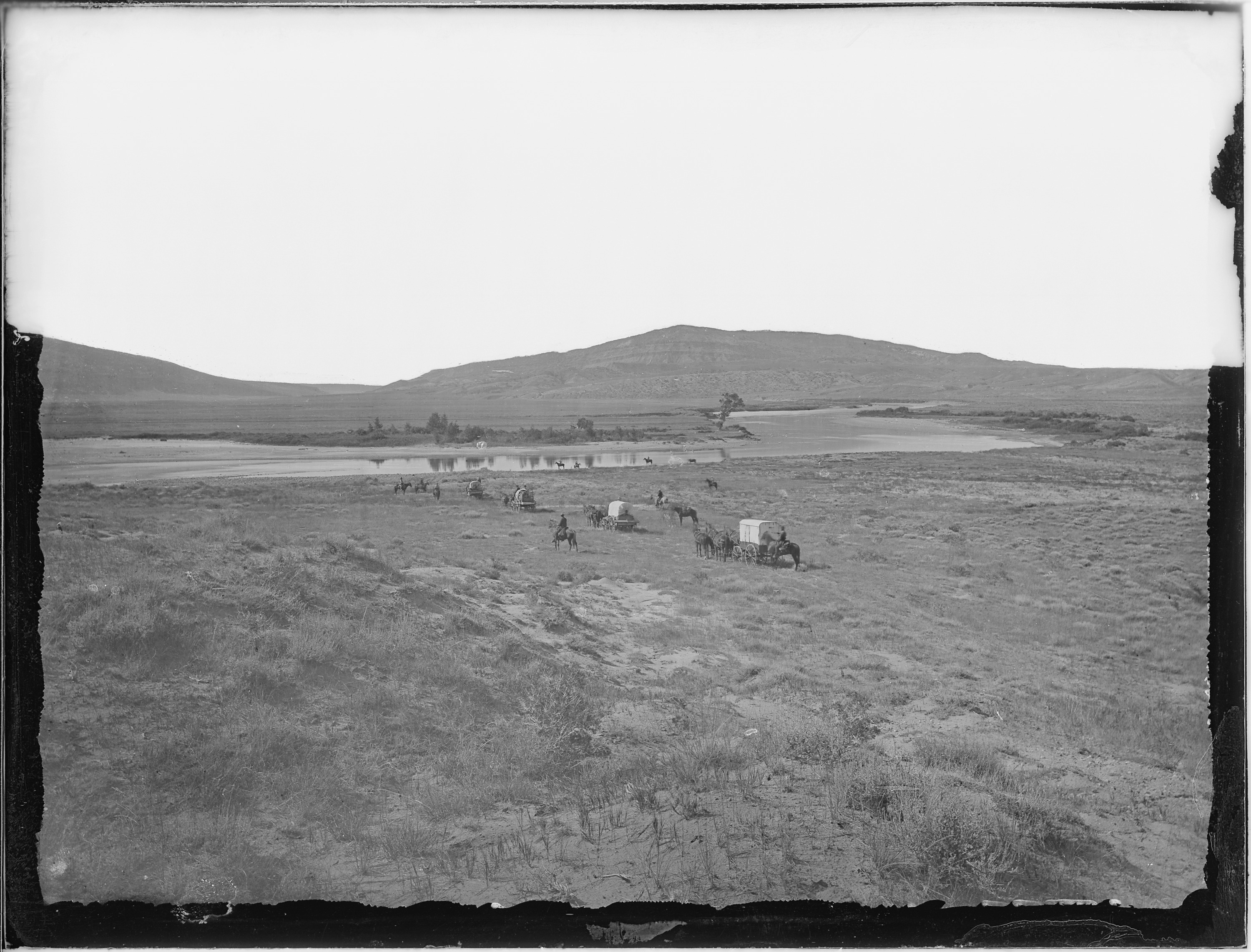 Scope and content:  Original caption: View of the Red Buttes at what is now known as Bessemer Bend, a notable point of the old Oregon Trail where the Oregon Trail left the North Platte River for the Sweetwater. The approximate location of a massacre of 23 U.S. troopers in 1865, which occurred at the same time as the death of Caspar Collins at that bridge, for whom the town of Casper was named.