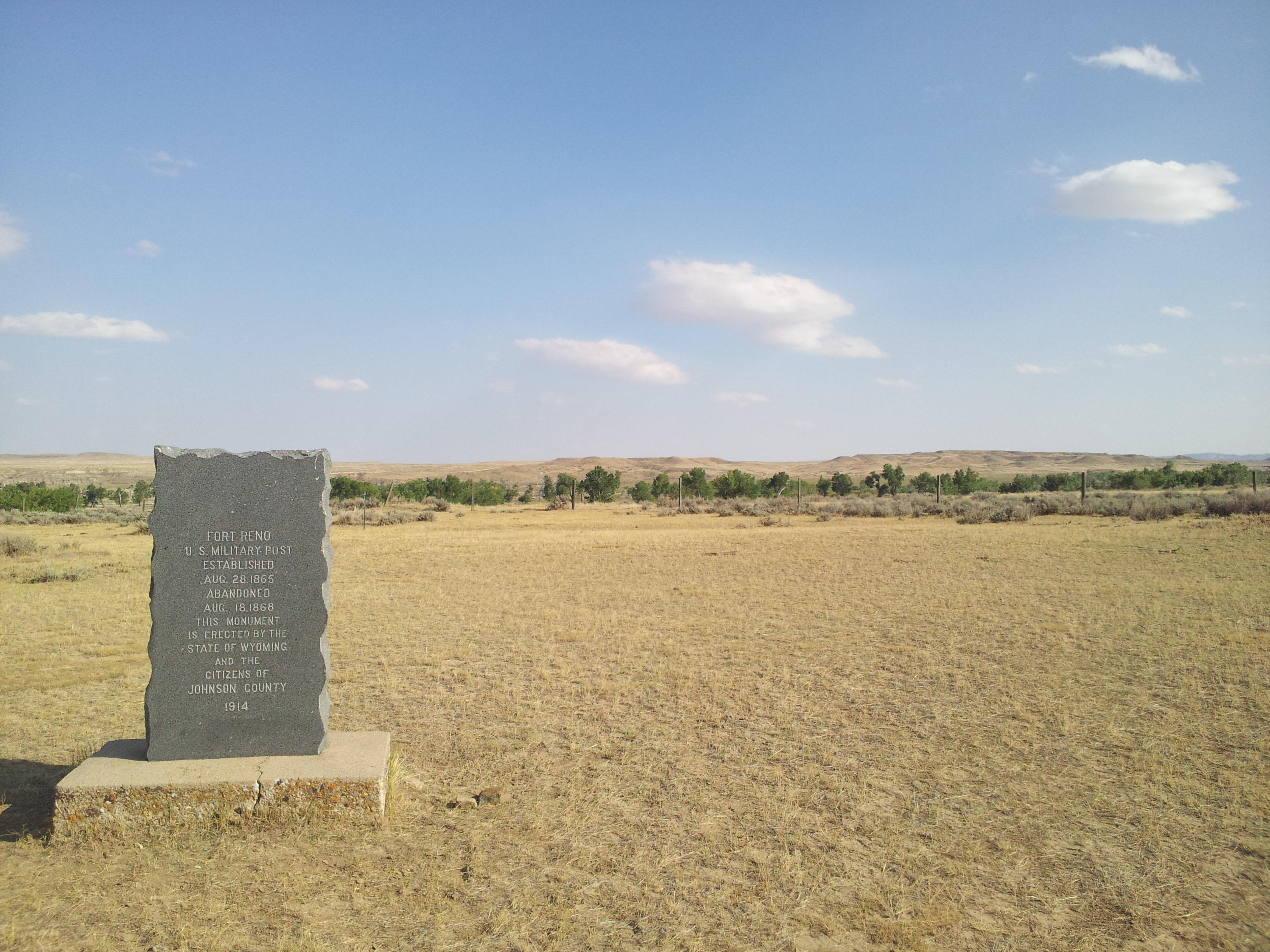 This shows the Fort Reno in the foreground, and the Powder River, a line of cottonwood trees, in the background.