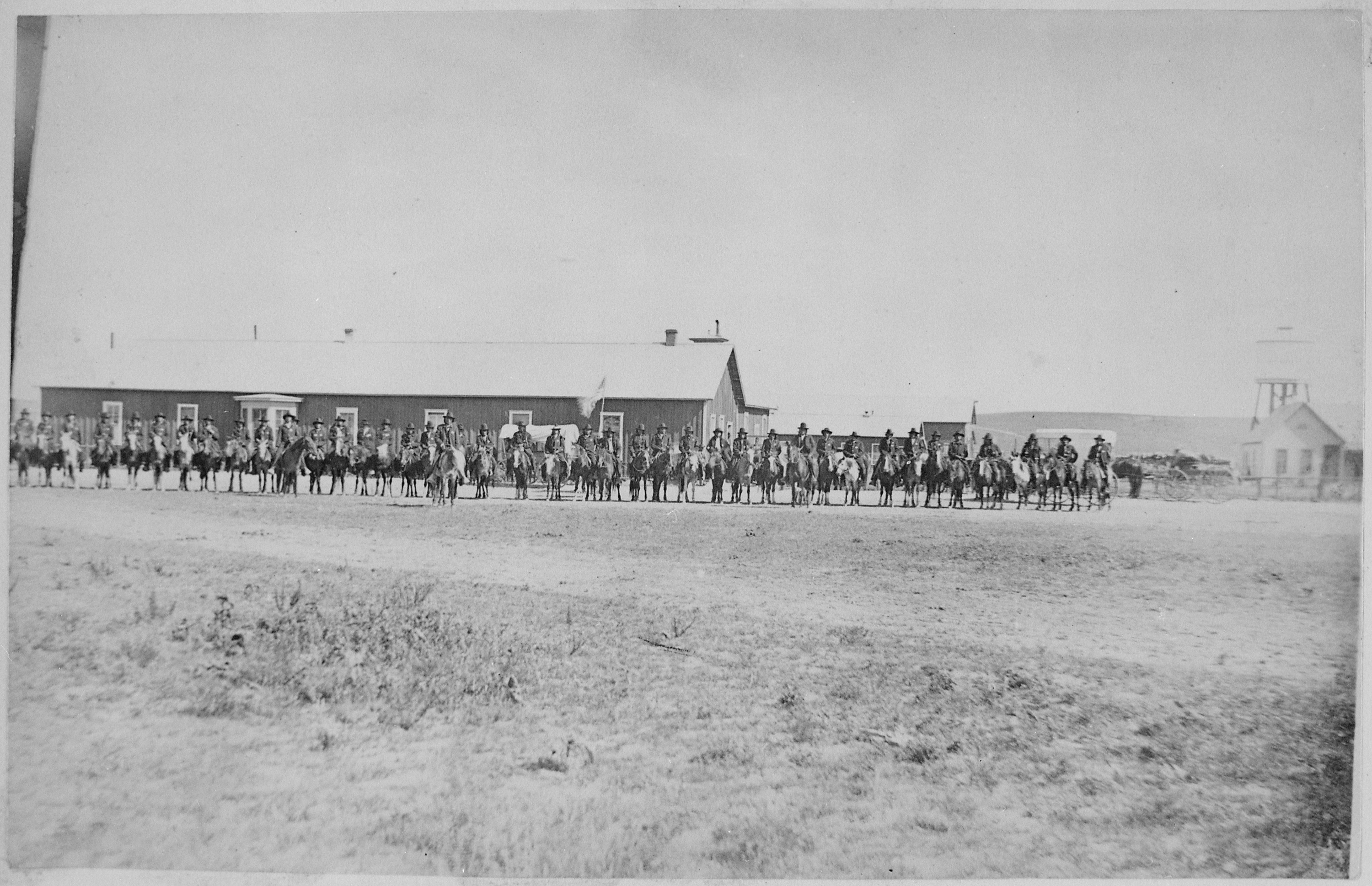 Sioux Indian police lined up on horseback in front of Pine Ridge Agency buildings, Dakota Territory, 08-09-1882 - NARA - 519143.jpg