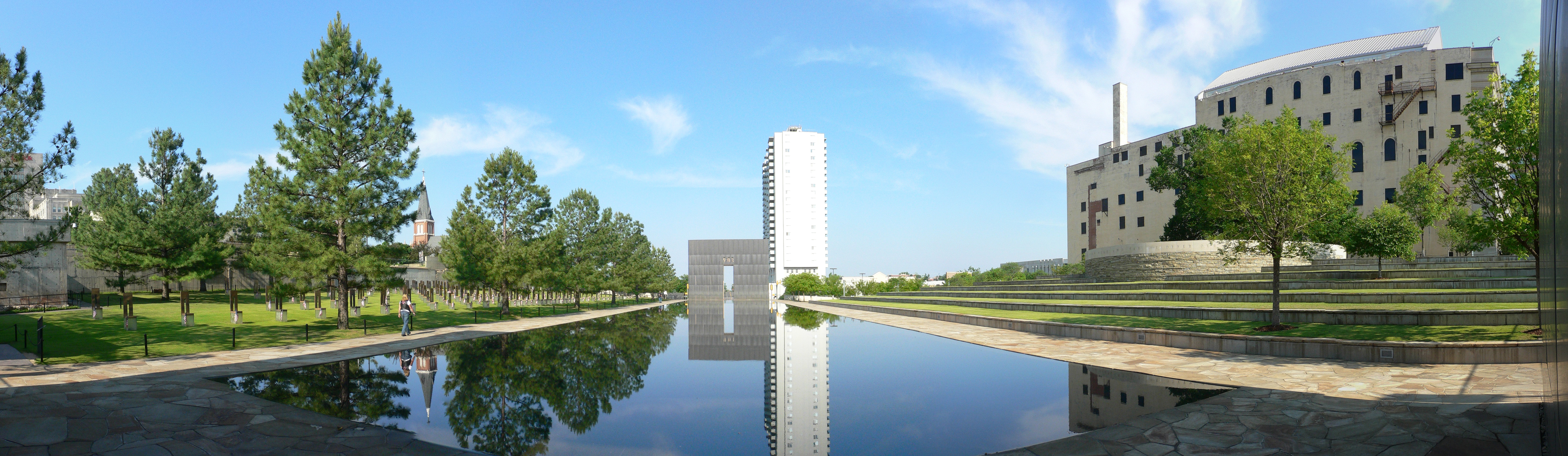 Panoramic picture of the Oklahoma City Memorial.Stitching errors, white building overexposed, posterisation (probably caused by JPEG compression), slight chromatic aberration, inappropriate file type