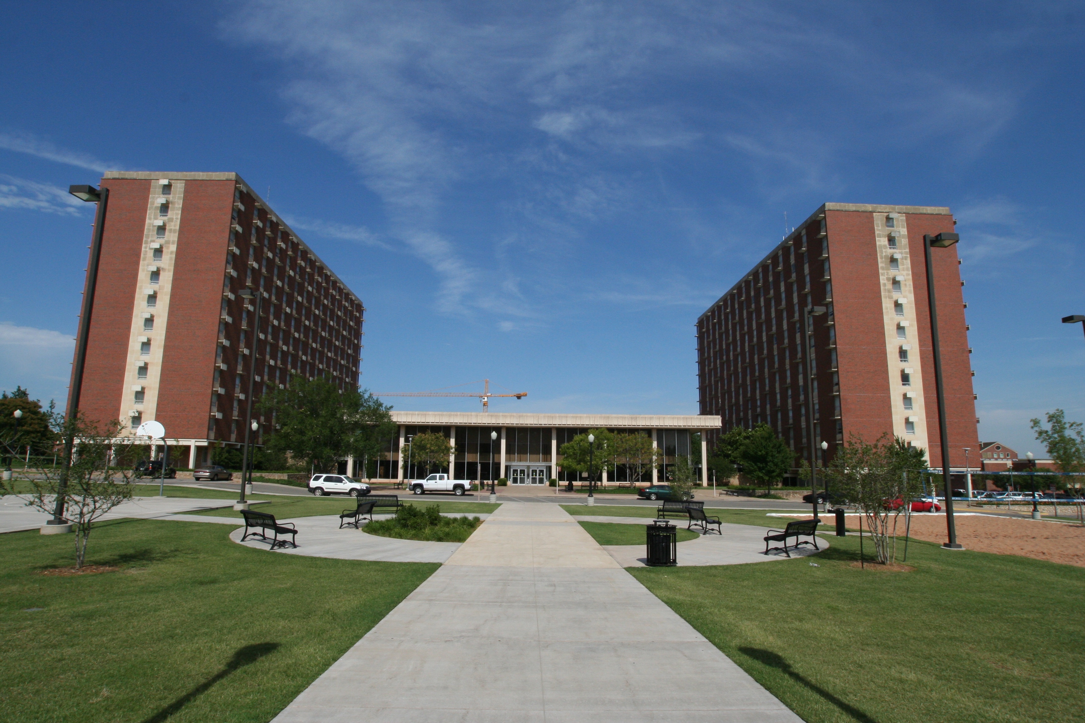 Kerr (left) and Drummond (right) high-rise residence halls as well as "mezzanine" building (center) on the campus of Oklahoma State University.