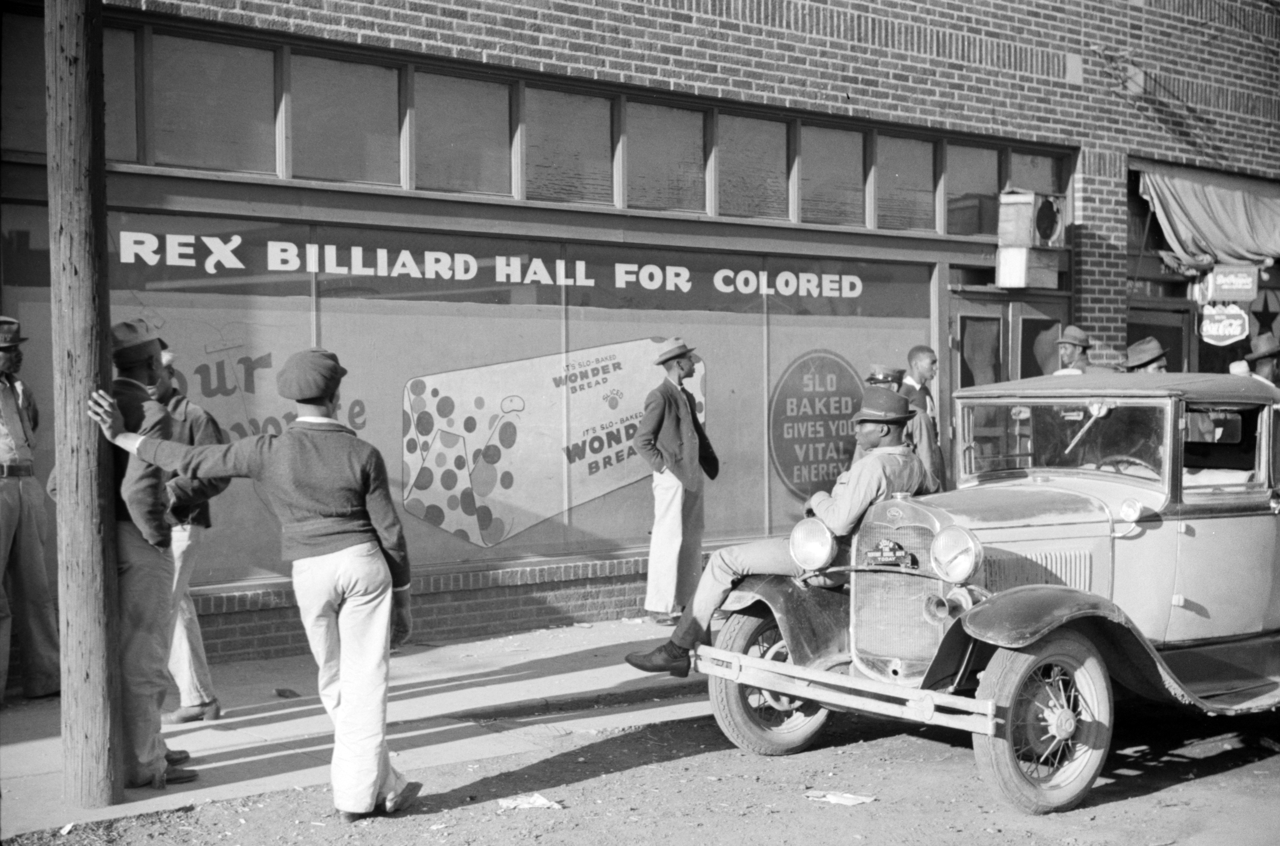 "Beale Street, Memphis, Tennessee." [Sign: "Rex Billiard Hall for Colored."] Location: E-936 Reproduction Number: LC-USF33-30639-M1