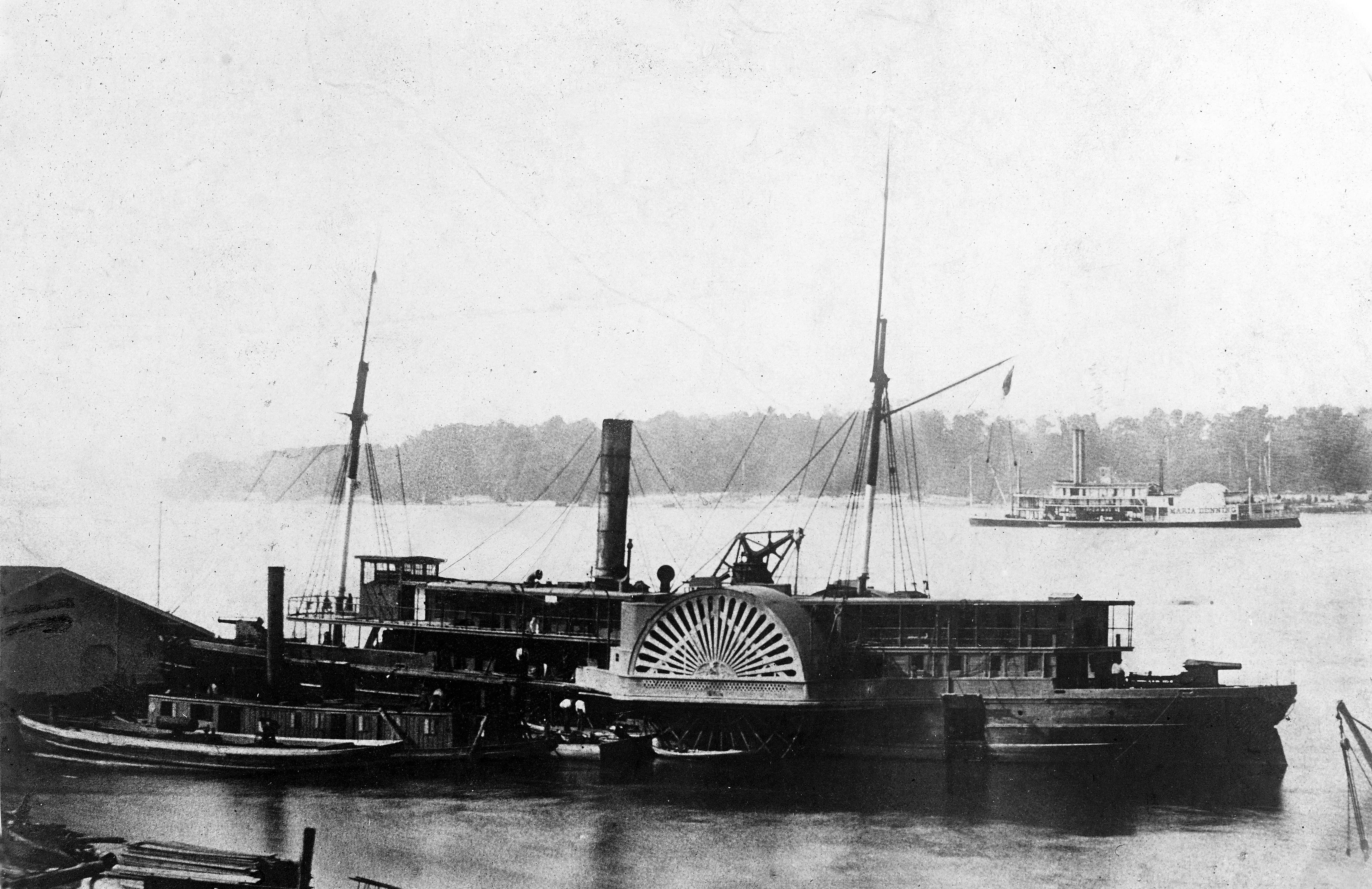 NH 46642 USS General Bragg (1862-1865); Probably photographed at Cairo or Mound City, Illinois, circa 1862-1863. Two small tugs are fitting out at left. USS Maria Denning (1861-62) is offshore at right. U.S. Naval Historical Center Photograph, Photo #: NH 46642