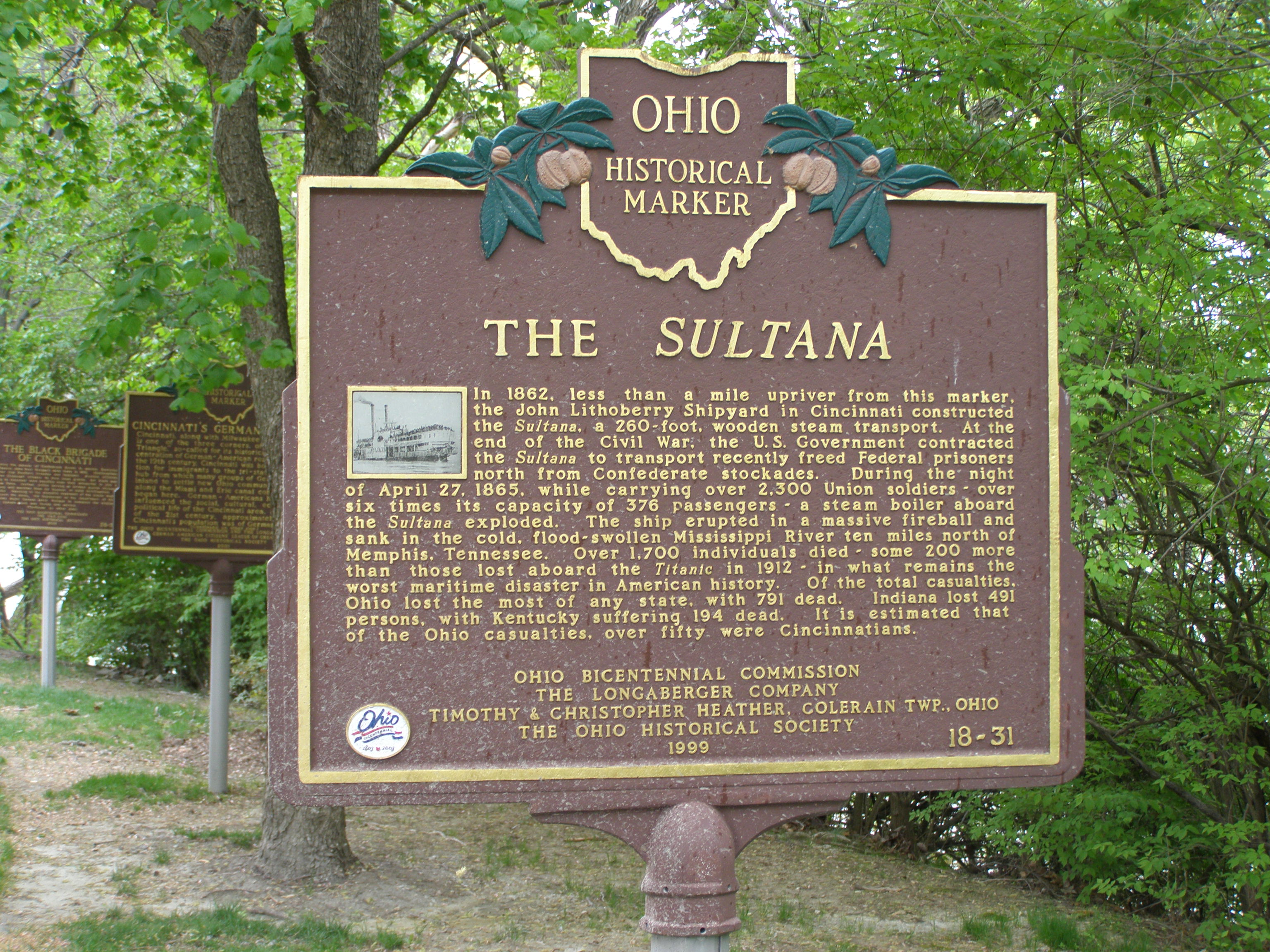 Sultana Historic Marker in Cincinnati, Ohio.
In 1862, less than a mile upriver from this marker, the John Lithoberry Shipyard in Cincinnati constructed the Sultana, a 260-foot, wooden steam transport. At the end of the Civil war, the U.S. government contracted the Sultana to transport recently freed Federal prisoners north from Confederate stockades. During the night of April 27, 1865, while carrying over 2,300 Union soldiers over six times its capacity of 276 passengers 0- a steam boiler abroad the Sultana exploded. The ship erupted in a massive fireball and sank in the cold, flood-swollen Mississippi River ten miles north of Memphis, Tennessee. Over 1700 individuals died - some 200 more than those lost aboard the Titanic in 1912 - in what remains the worst maritime disaster in American history. Of the total casualties, Ohio lost the most of any state, with 7901 dead. Indiana lost 491 persons, with Kentucky suffering 194 dead. It is estimated that of the Ohio casualties, over fifty were Cincinnatians.