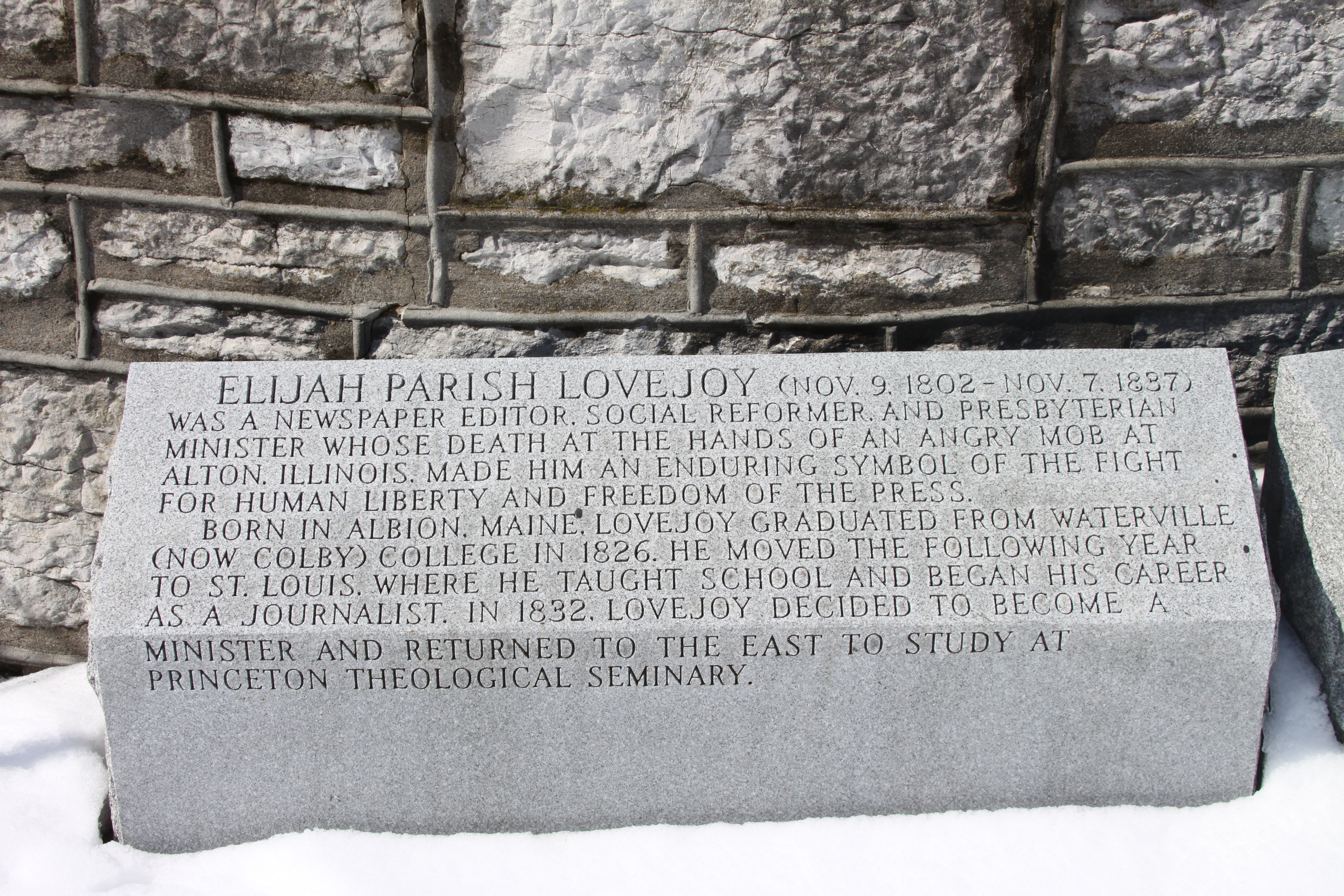 First Block of Elijah Lovejoy's story to the left of the monument after you climb the steps.