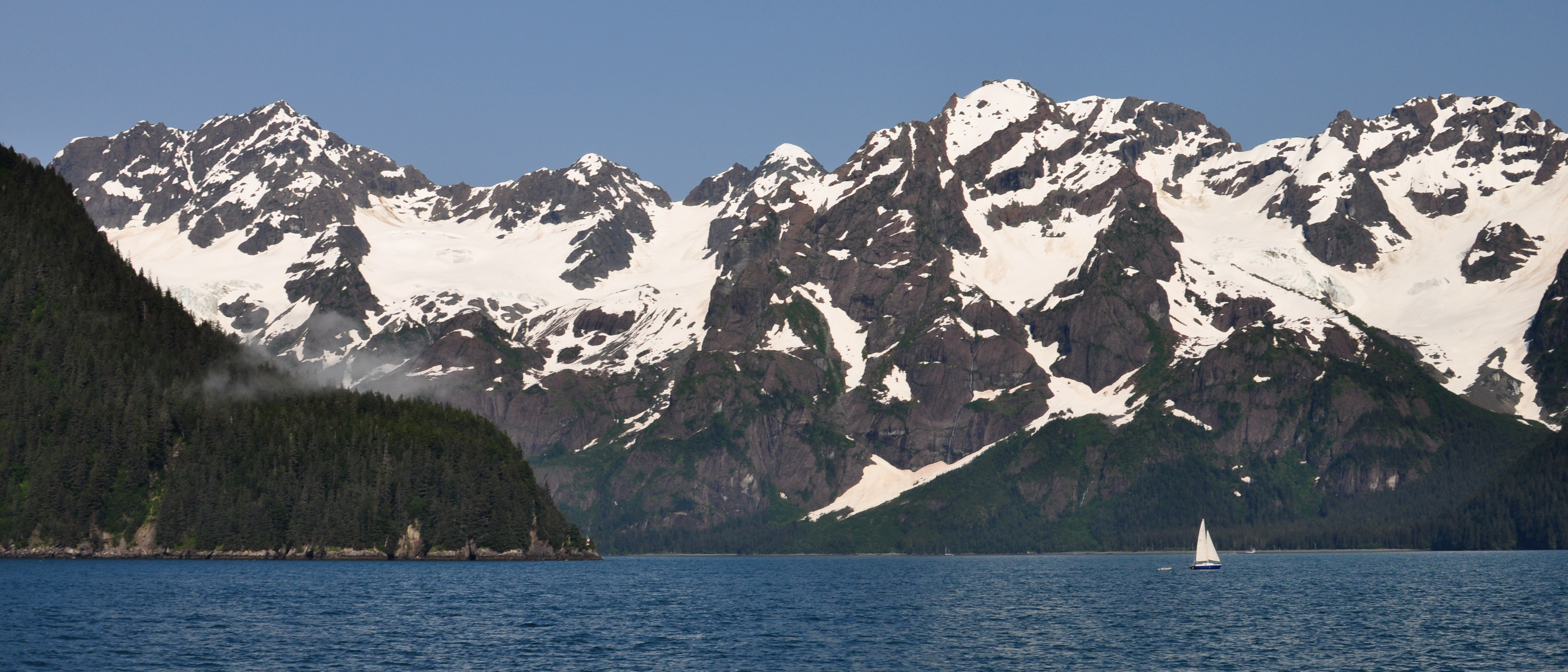 A sailboat near the mouth of Thumb Cove, in Resurrection Bay, Kenai Fjords, Alaska