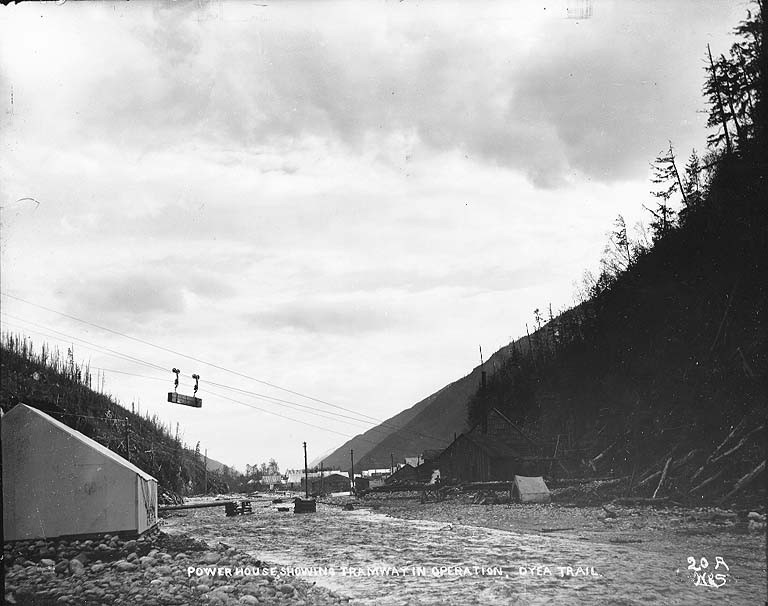 Possibly of the Dyea-Klondike Transportation Company.                                                Caption on image: "Power house showing tramway in operation, Dyea Trail"                                                Original image in Hegg Album 1, page 17.                                                Original photograph by Eric A. Hegg 84; copied by Webster and Stevens 20.A.
Subjects (LCTGM): Aerial tramways--Alaska; Trails--Alaska; Power plants--Alaska
Subjects (LCSH): Chilkoot Trail