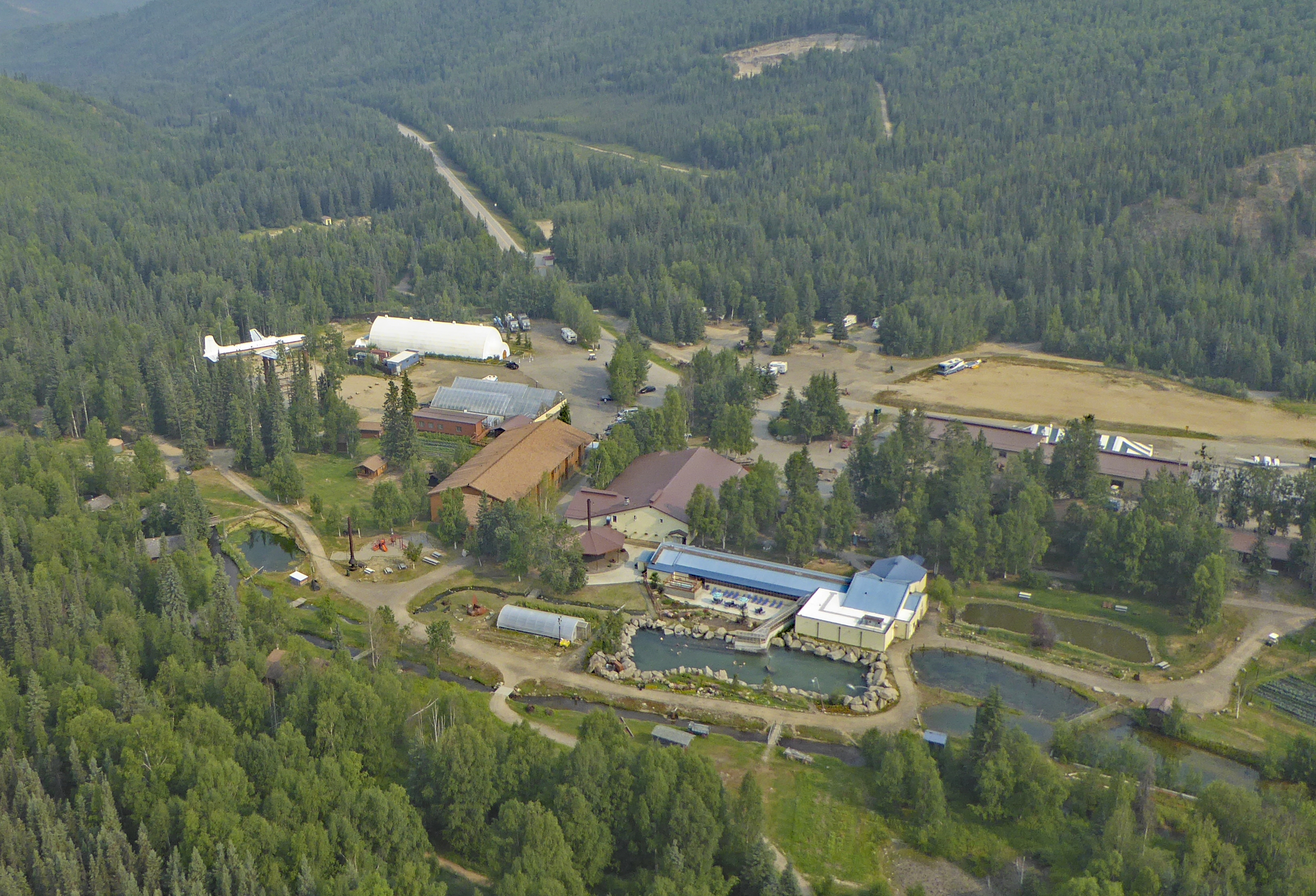 View from a Robinson R22 of Chena Hot Springs with the springs in the foreground, DC6 on the left and the campground in the distance